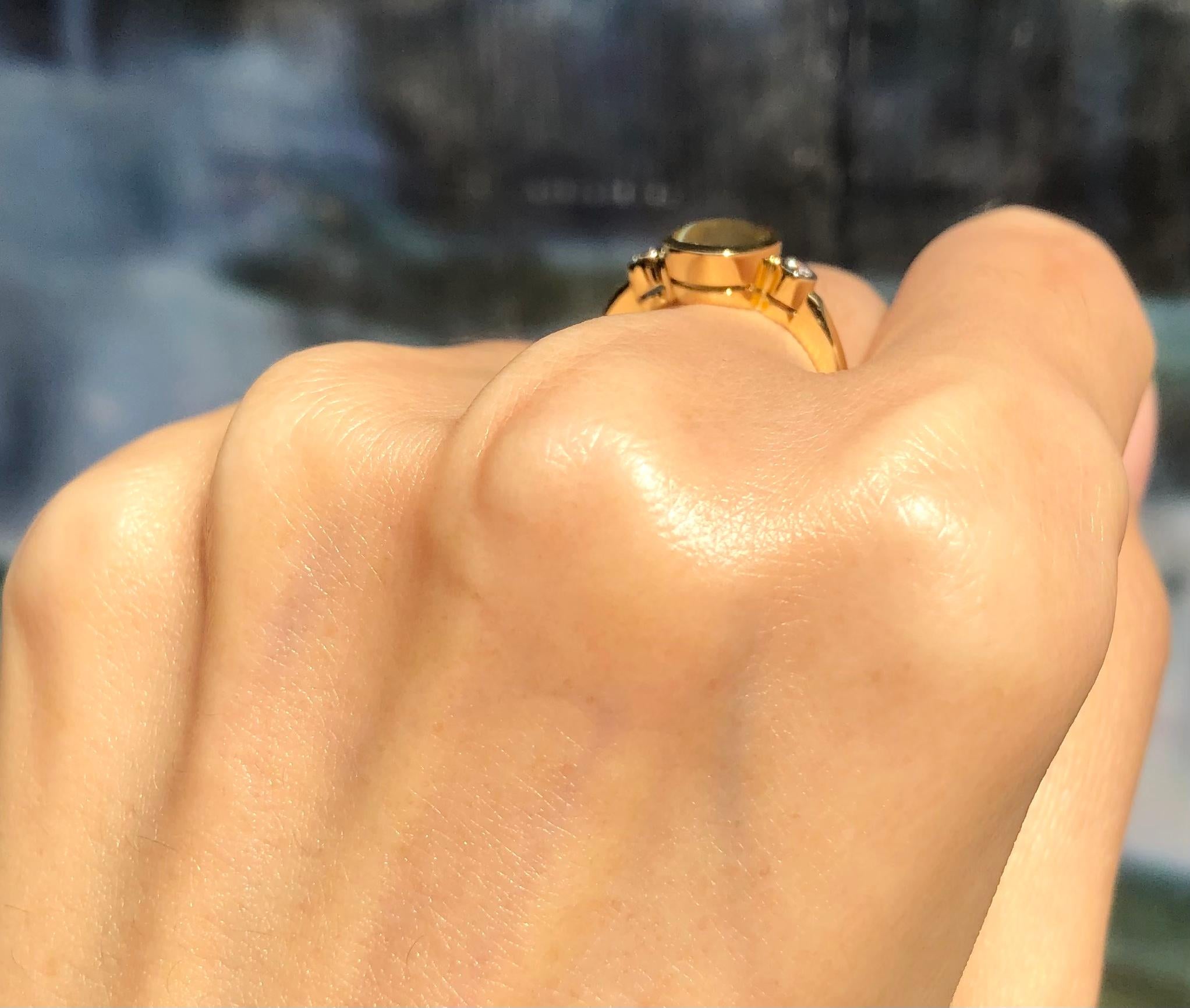 Contemporary Chrysoberyl Cat's Eye with Diamond Ring Set in 18 Karat Gold Settings For Sale