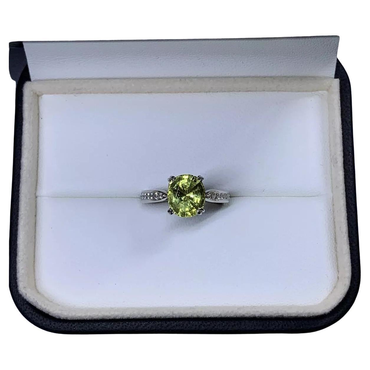 Chrysoberyl Oval Cushion and diamonds engagement ring in platinum.