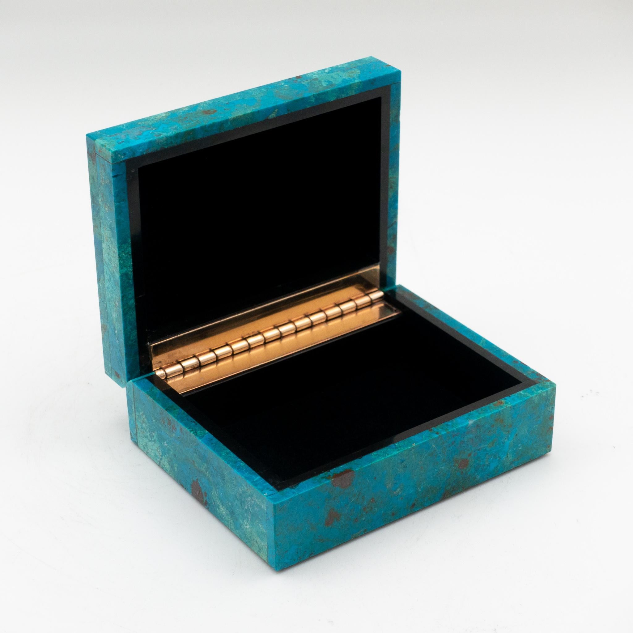Chrysocolla hinged box; minerals sourced from Peru then sent to India to produce this exquisite box.
Chrysocolla has also been popular for use as a gemstone for carvings and ornamental use since antiquity due to its vivid, beautiful blue and