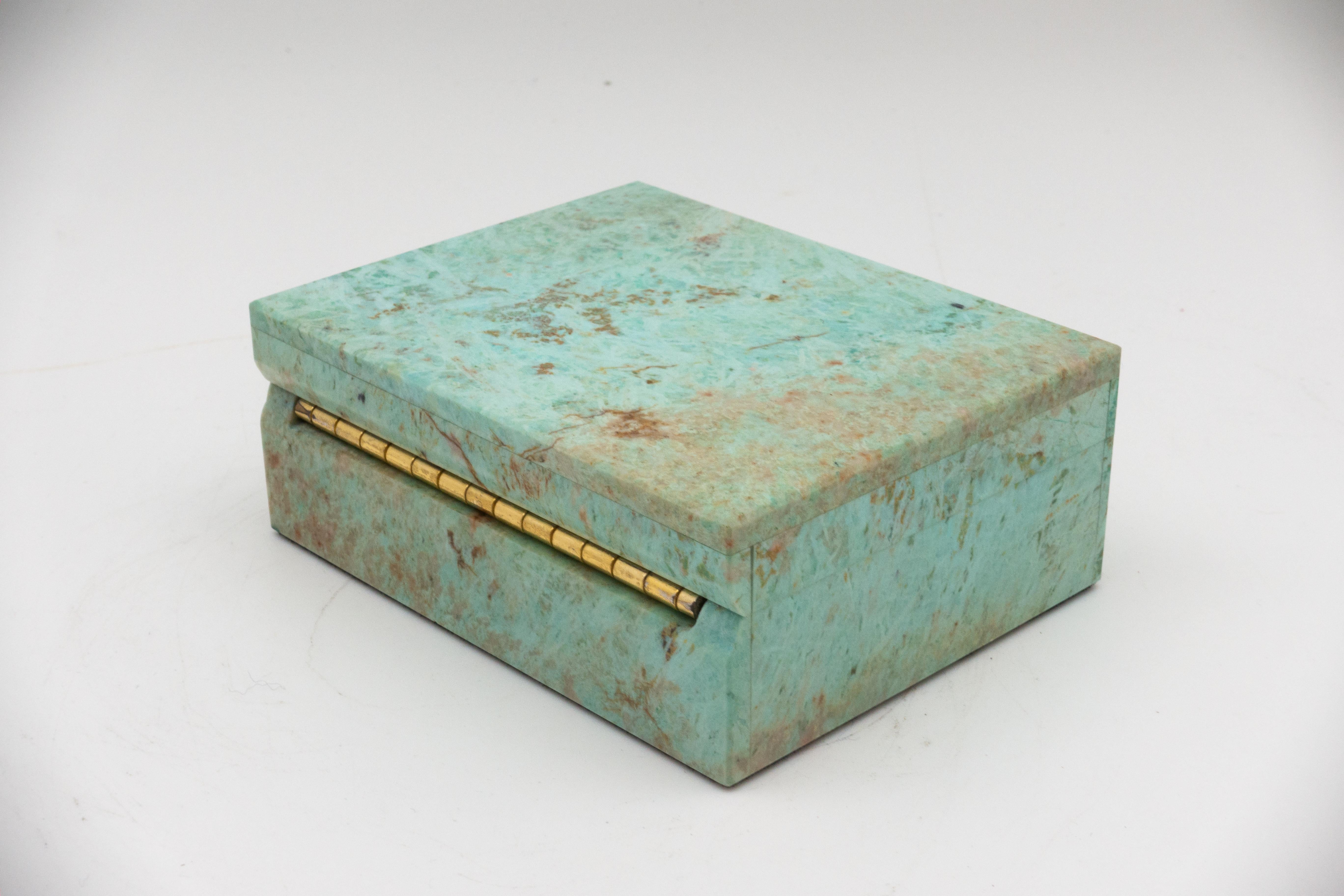 Chrysocolla and turquoise hinged box; minerals sourced from Peru then sent to India to produce this exquisite box.

Turquoise is an opaque, blue-to-green mineral that is a hydrated phosphate of copper and aluminum. It is rare and valuable in finer