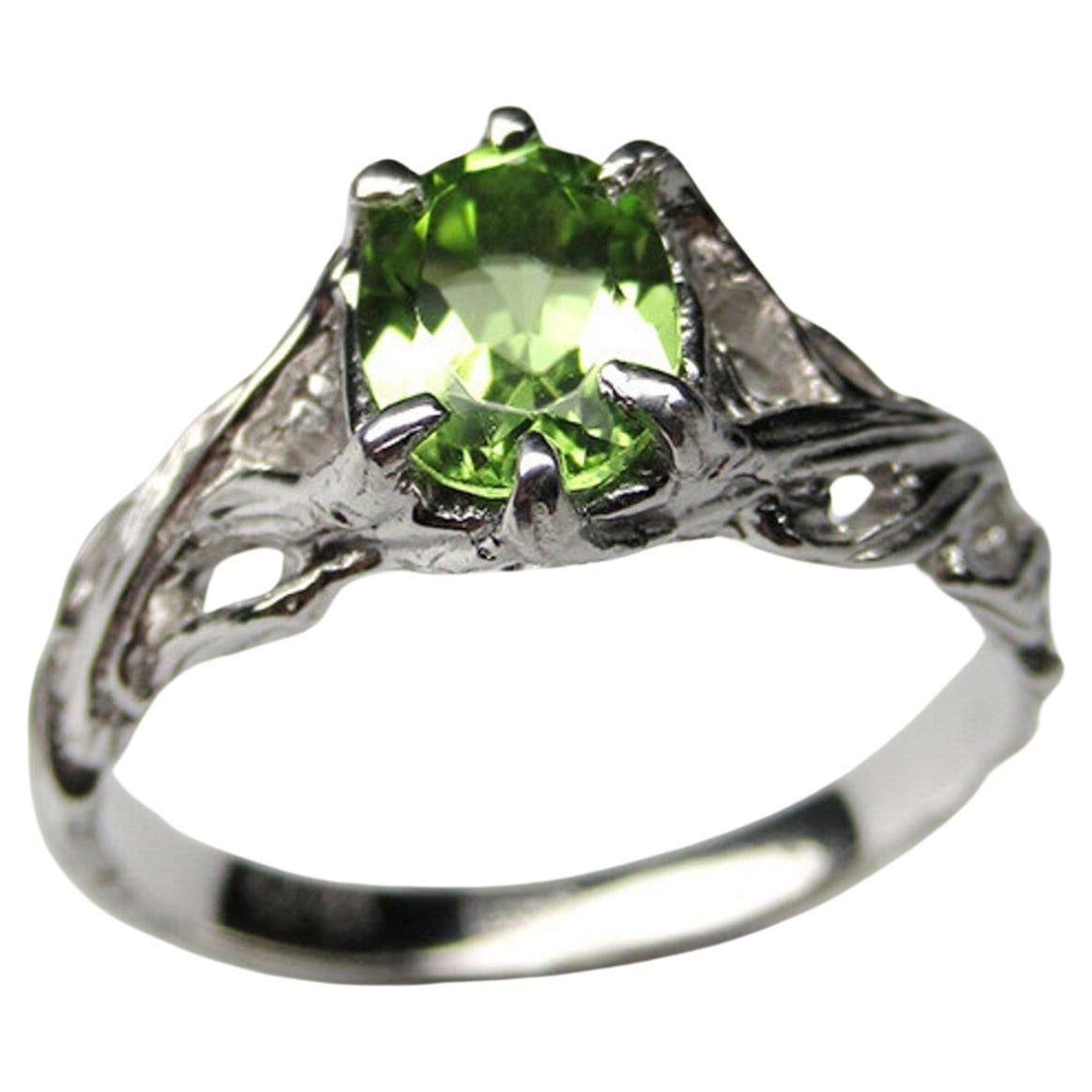 Silver ring with natural Chrysolite Peridot in classic oval cut
gemstone origin - China
stone measurements - 0.14 х 0.2 х 0.28 in / 3.5 х 5 х 7 mm
stone weight - 0.70 carats
ring weight - 2.33 grams
ring size - 6.5 US 