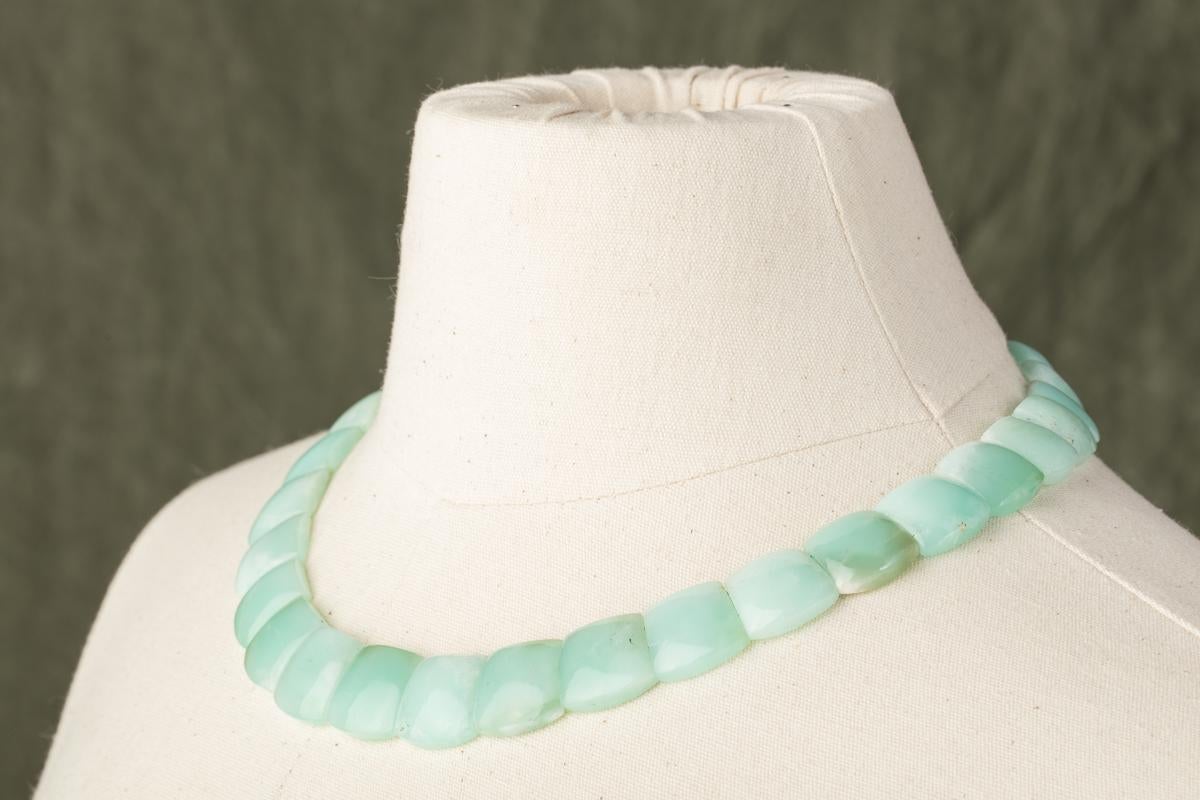 Lovely chrysophrase choker necklace, flat cut on the back side and rounded on the top.  Slightly graduated with sterling silver clasp.  468 carats.