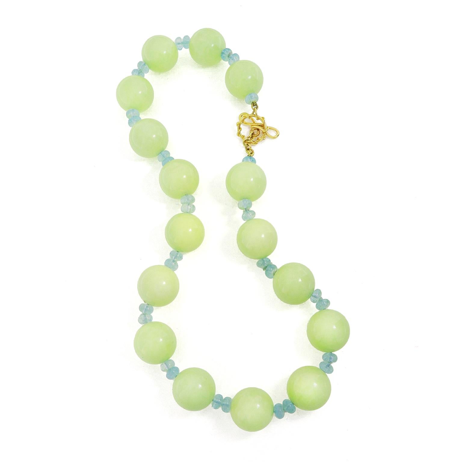 Cool toned gemstones orbit in this necklace. Chrysoprase in the variation of a soft sea foam green is the highlight. In between each globe of the chalcedony are two aquamarine roundels for a complementary accent. The total weights are 22 carats of