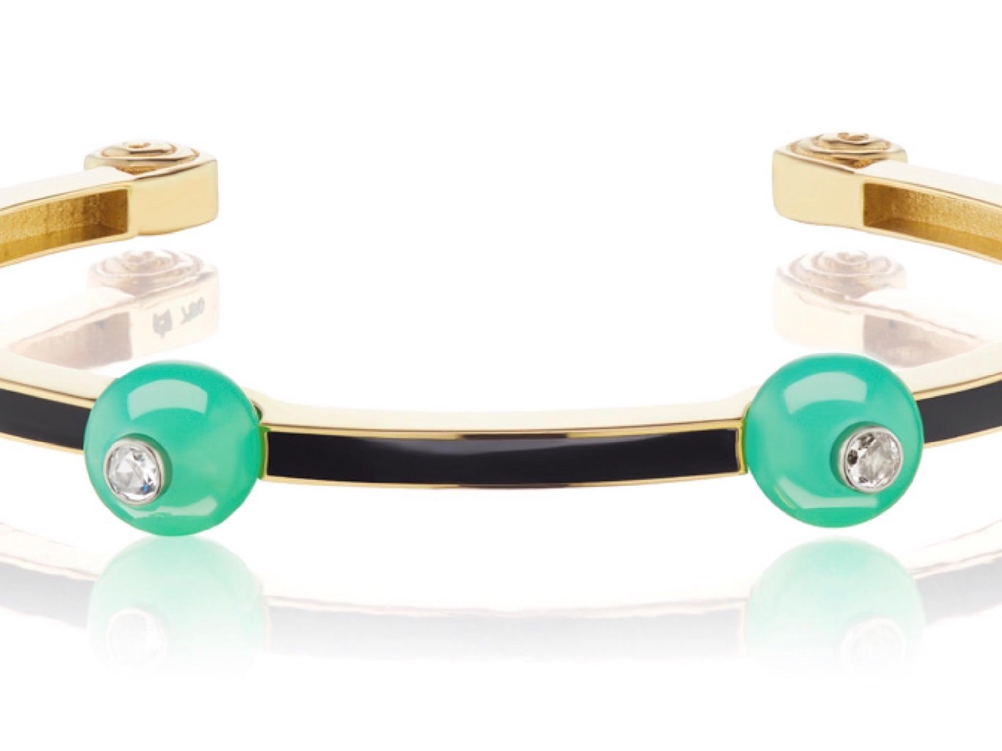 This new bracelet design by Andrew Glassford features 8.5mm Australian Chrysoprase spaced evenly between channels of black enamel in 18K Rose Gold. Australian Chrysoprase is considered one of the finest mine sources for the stone and the color is a
