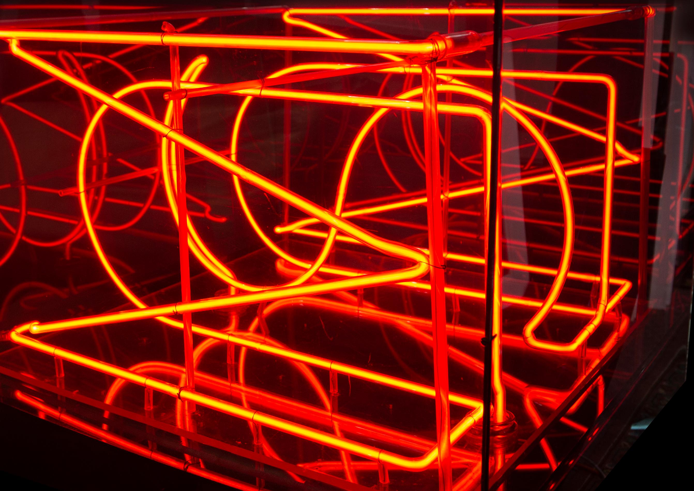 This is a unique neon sculpture in plexi-box with stand.  It is the very first completed Neon Sculpture by the famed sculptor and referenced in the monograph 