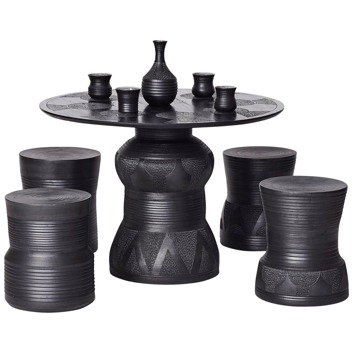 Chuma Maweni, "Imbizo", Carved Ebonized Timber and Clay Stool and Table Set