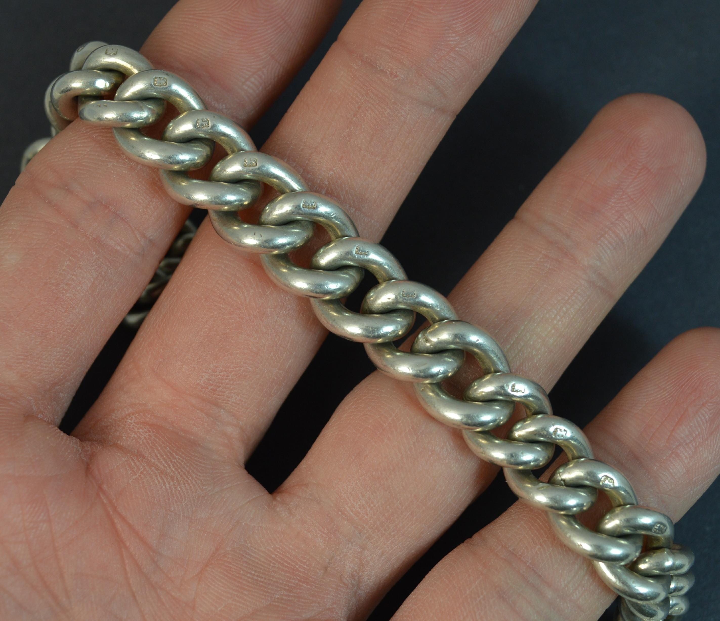 A sterling silver English made albert pocket watch chain. Good gauge of silver, crisp and chunky links of graduated sized links. Single albert design. Complete with tbar and replacement working clasp.
CONDITION ; Very good. Solid links. Working