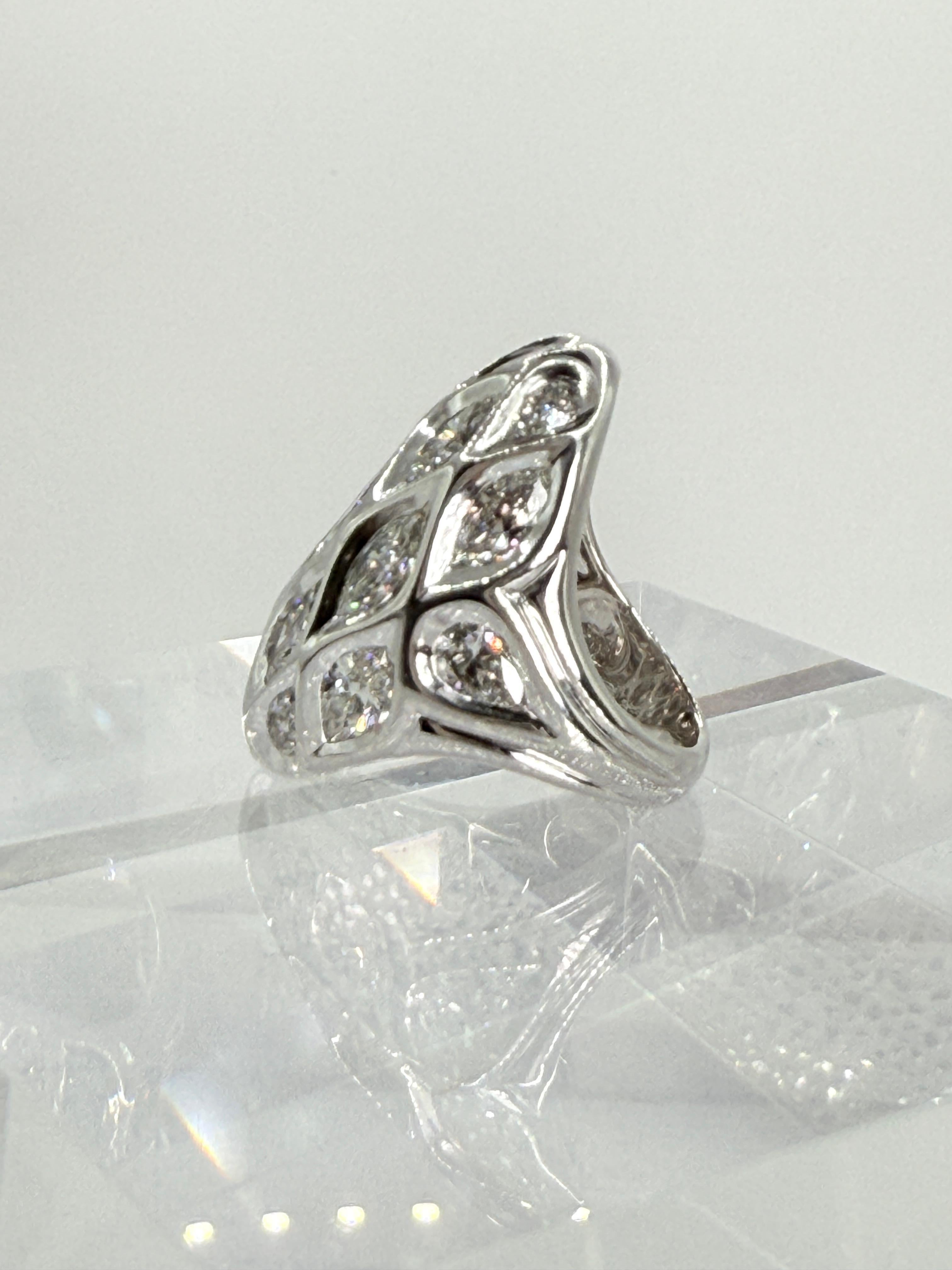 Set with Fancy Cut Marquise and Pear Shaped Diamonds in 18 Karat White Gold.
Average Clarity is VS and Average Color is J.
Stunning Statement Piece.
Stamped 