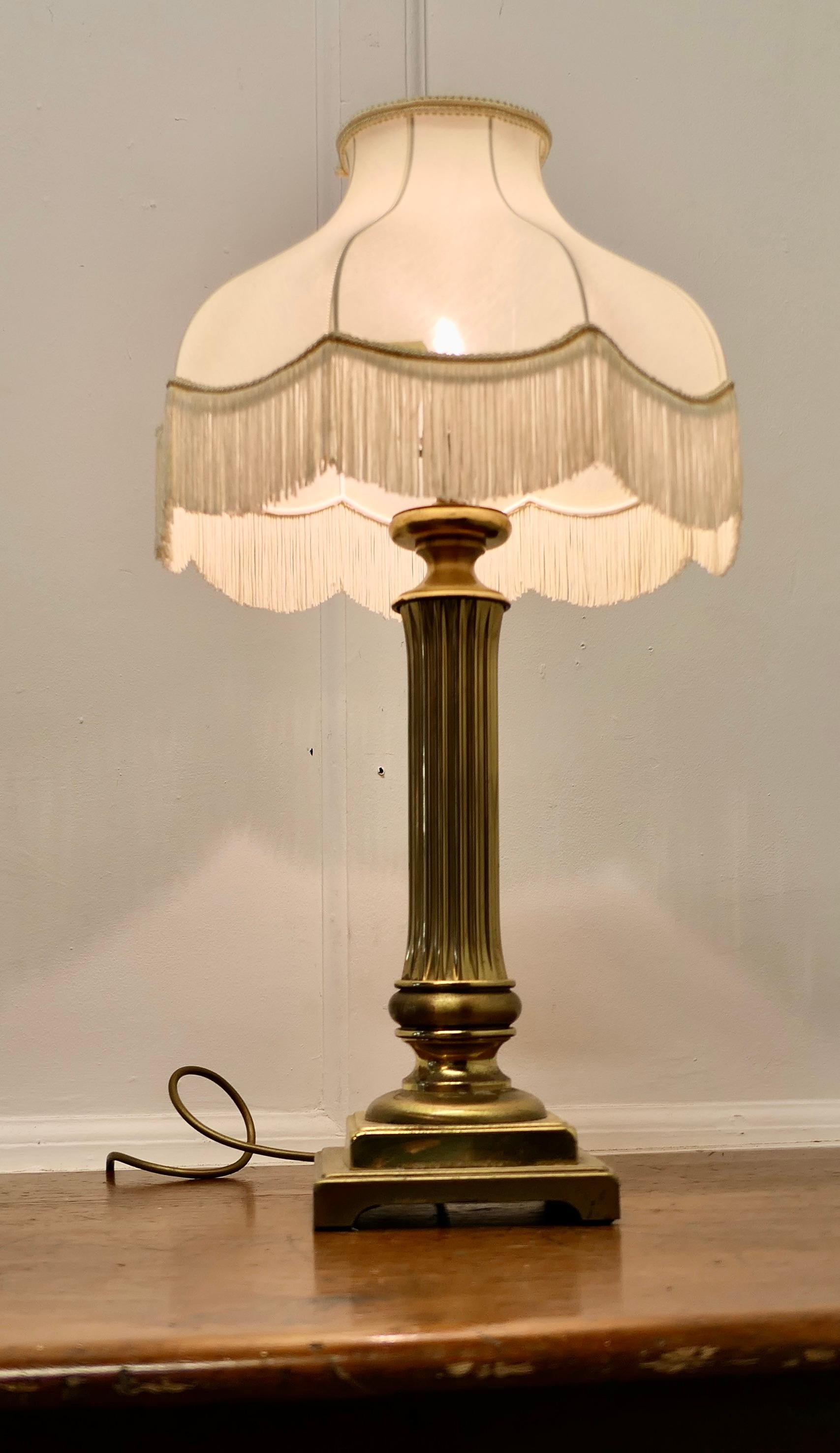 Chunky Brass Corinthian Column Table Lamp with Shade

This is a very attractive lamp it has a heavy single corinthian style column set on a stepped rectangular base, it comes with a neutral coloured linen lamp shade, this can be included if