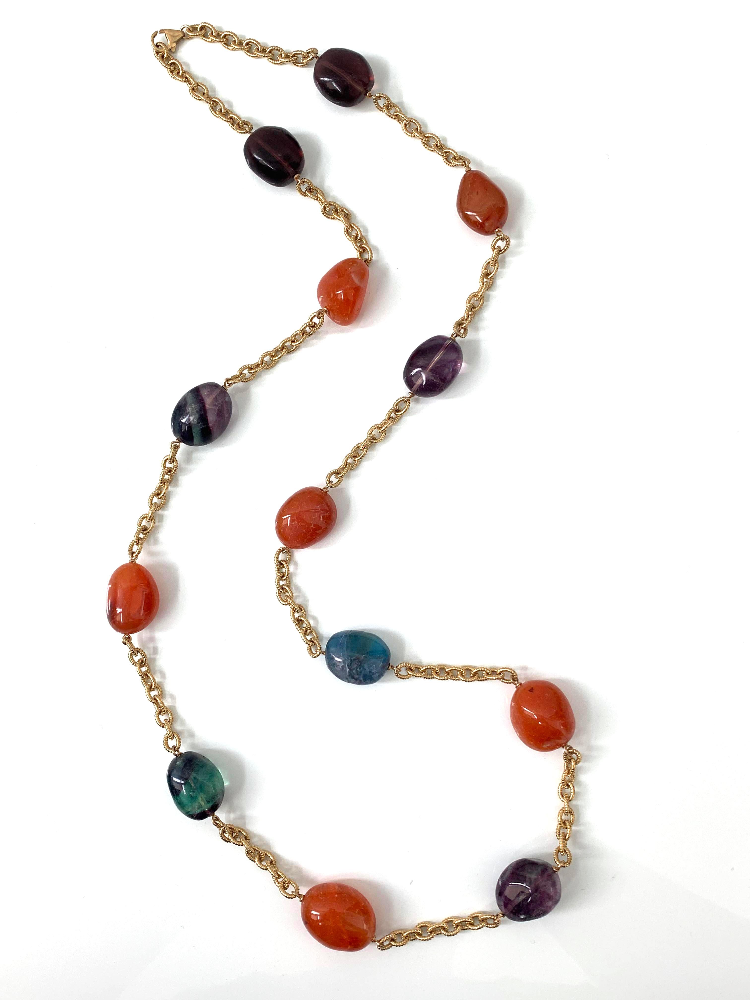 Chunky Carnelian & Bi-color Fluorite Long Chain Necklace

The necklace features 6 large tumbled carnelian and 7 large tumbled bi-color flurite. Each station is hand wire wrapped with 18k gold-filled wire and interconnected with beautiful textured