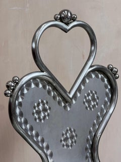 Chunky chrome heart shape chair