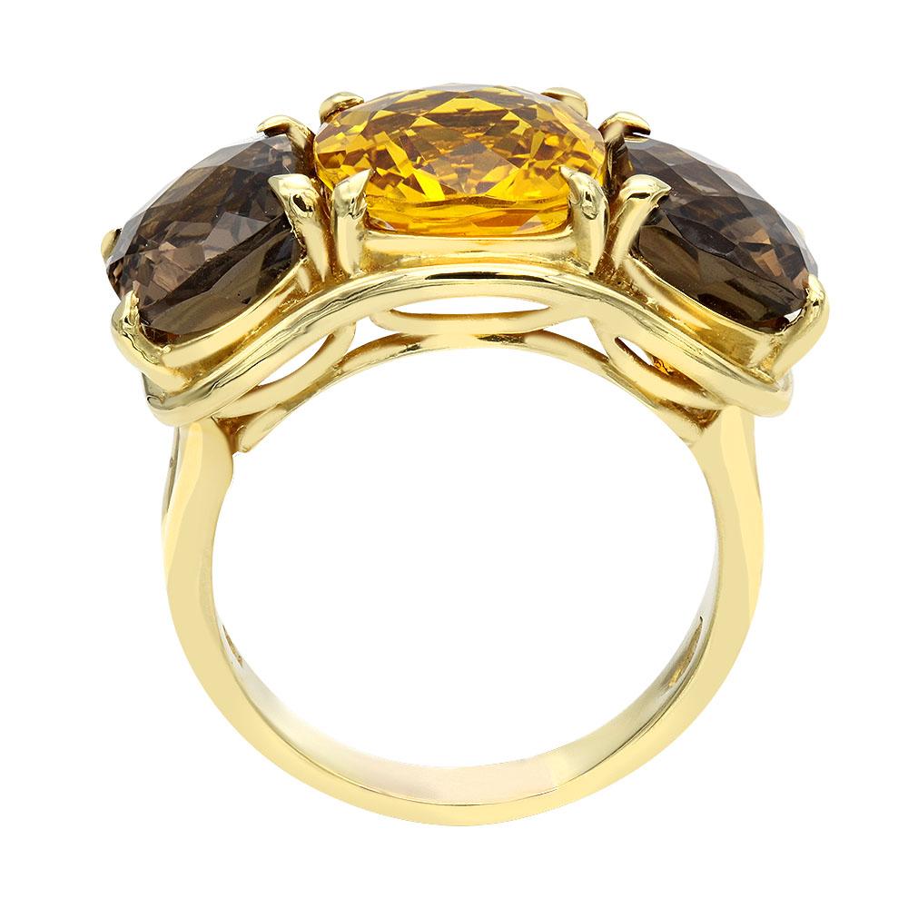 Ladies beautiful three stone ring.
Center contains 5.95 carat cushion cut citrine.
Two sides cushion cut smoky topaz total weight 6.05 carat.
Handcrafted in 18k yellow gold.
10 grams.
Size 7 1\2.
13 mm
Expert Ring Sizing available  on the premises