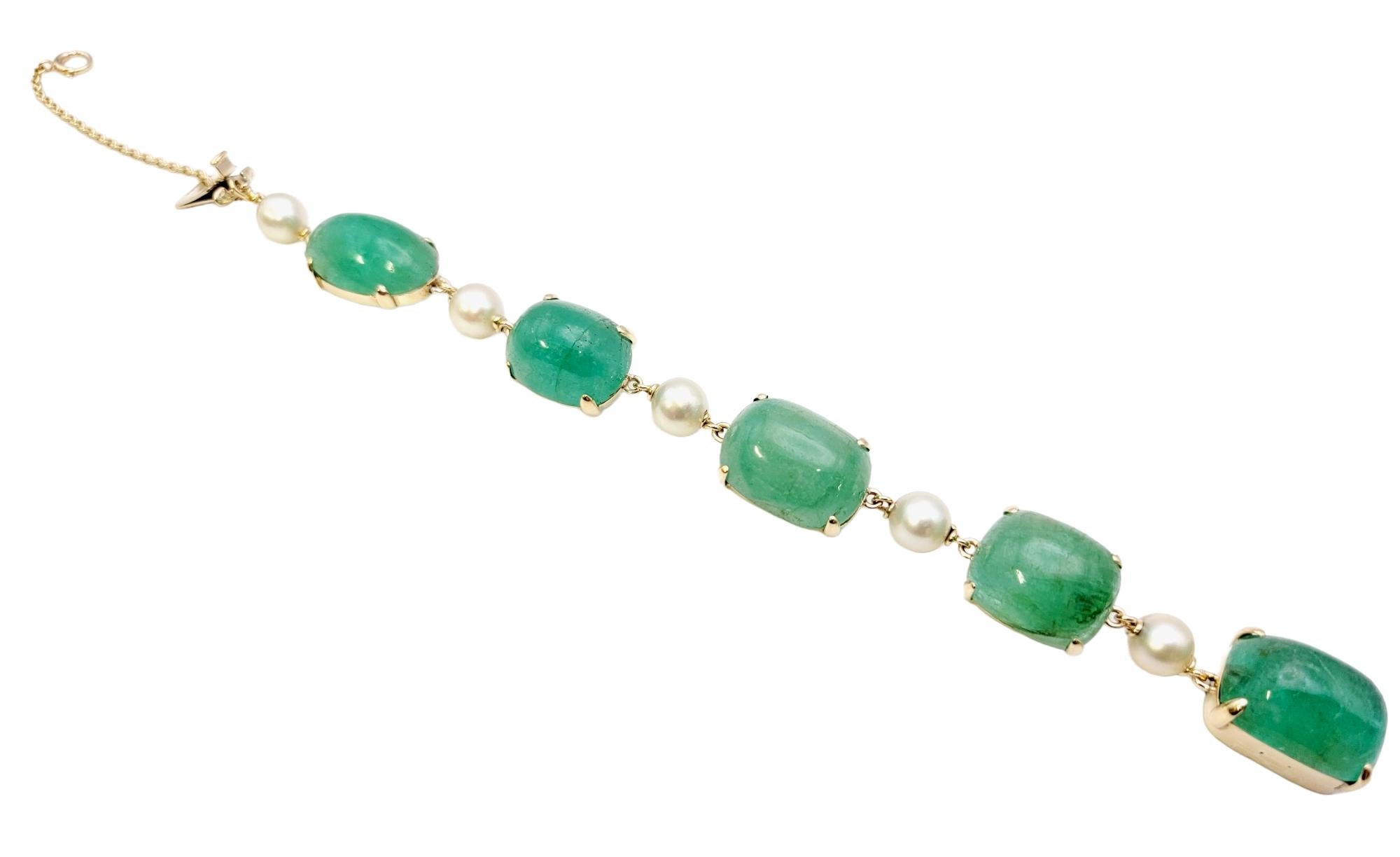 We are thrilled to feature this absolutely stunning bracelet with a bold and beautiful design.  Five incredible natural cabochon emerald stones line the wrist, filling it with color. Each stone is unique in its shade of green and natural variations,