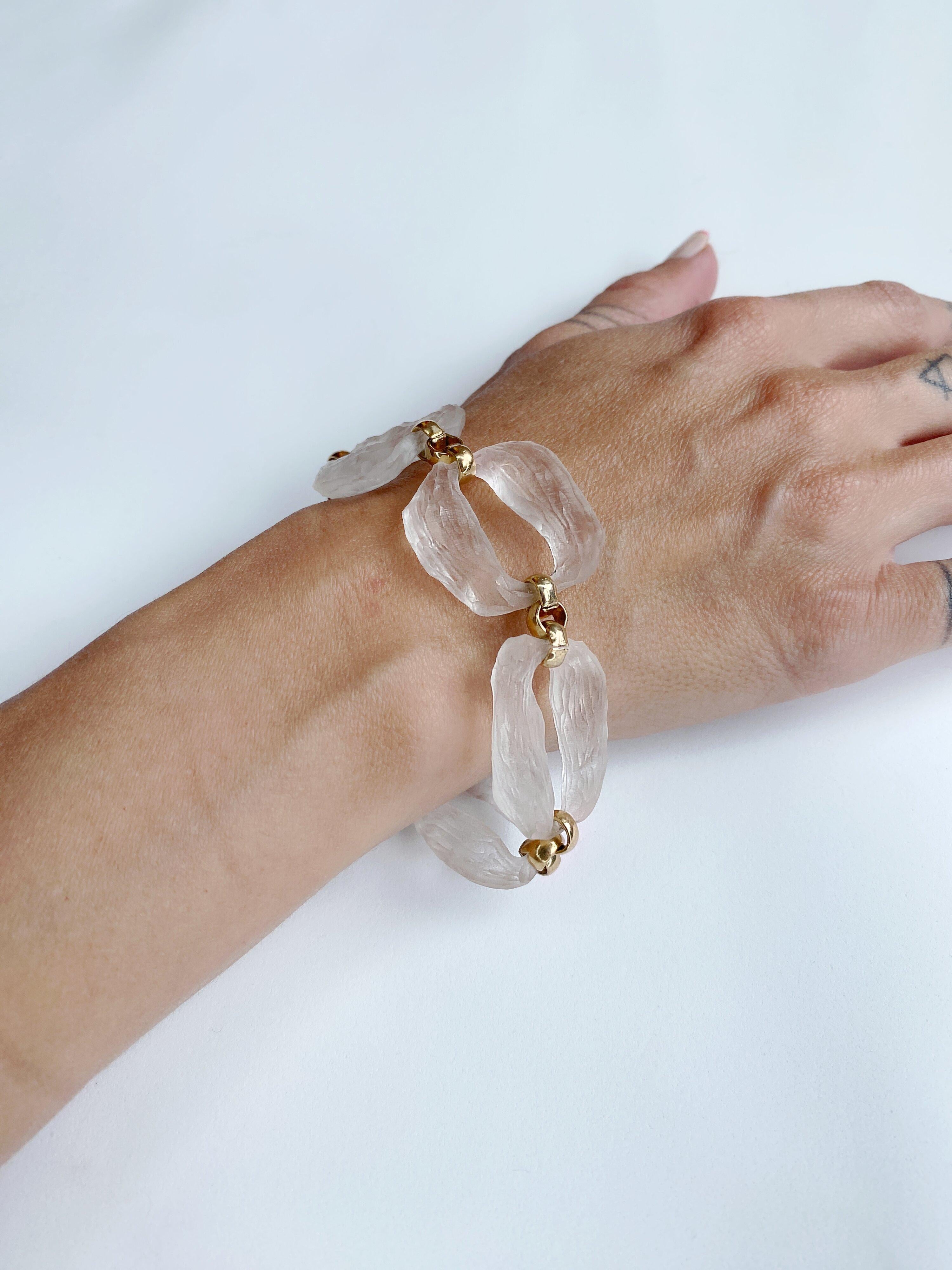 Chunky, elegant and timeless. This hand carved bracelet features clear lucite links resembling quartz crystal. Each link is connected with gold filled chain, making this bracelet a real eye catcher, yet confortable and durable.