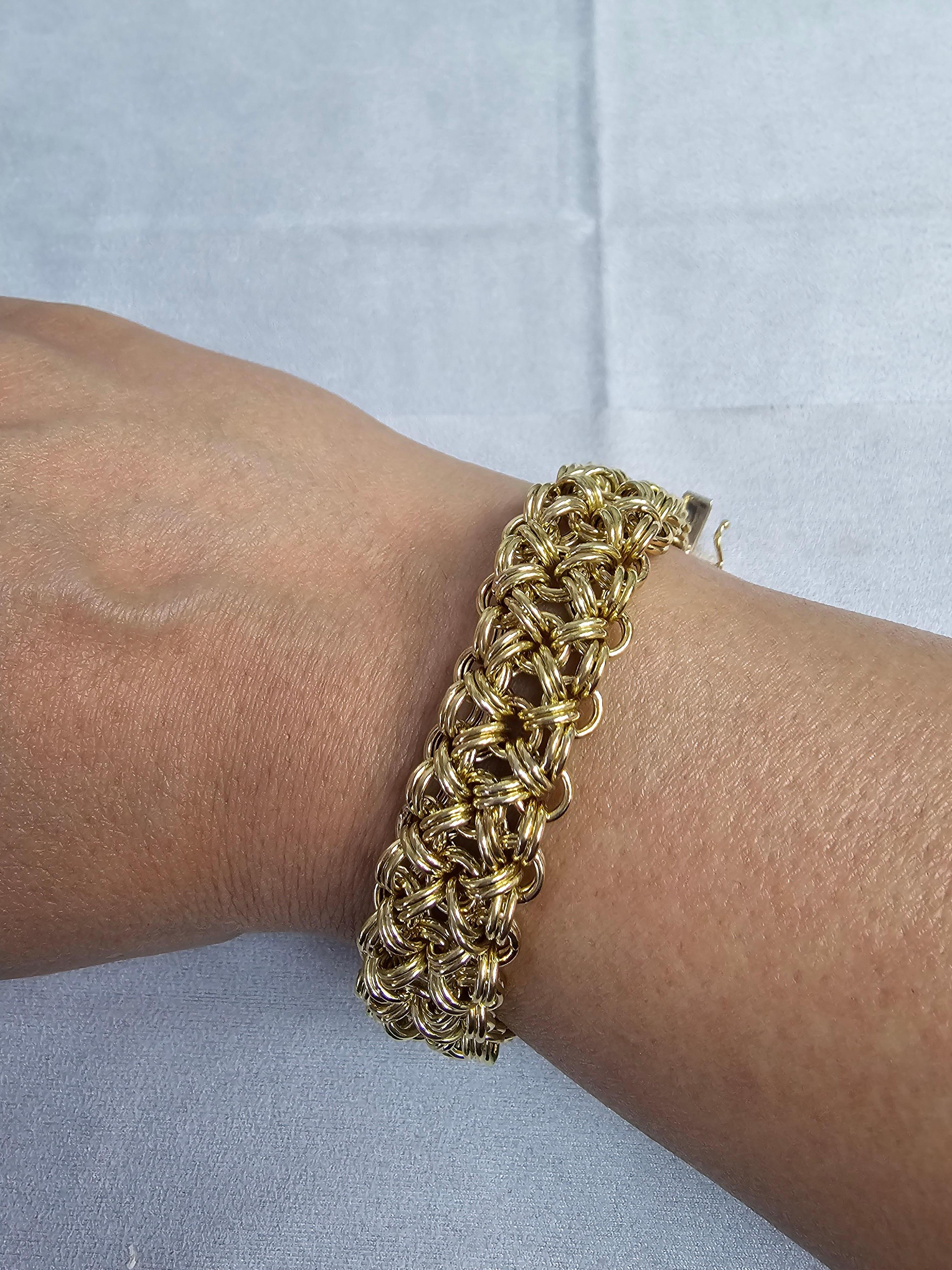 ♥ Product Summary ♥

Details: Chunky Intertwined Link Bracelet 
Metal: 14k Yellow Gold
Weight: 18 grams
Width: 14mm
Length: 7.5 inches
Closure: Lobster

Bracelet is solid 14k Gold, not filled or plated