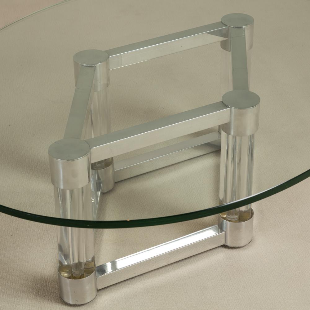 A chunky Lucite and aluminum coffee table base in the shape of a diamond where the cylindrical Lucite forms the supports at each corner, 1970s.
Price excludes glass top although one can be supplied at cost. 
 
Base dimensions: H 40cm, W 85cm, D