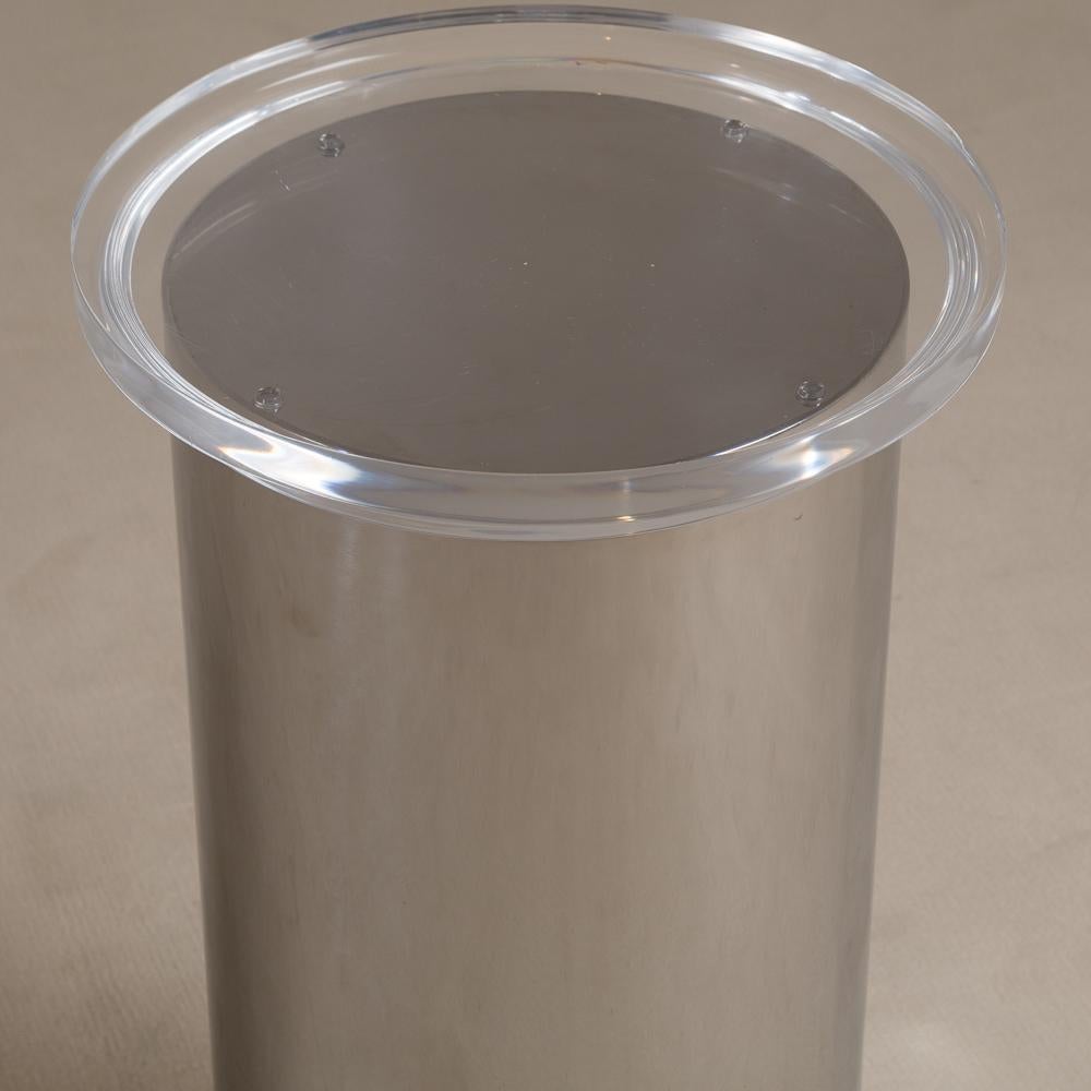 A cylindrical steel pedestal or table base with a stepped Lucite top and graduating chunky Lucite base, 1970s

Measure: Diameter at Top of pedestal 40cm
Light scratches to the lucite and metal work.
  