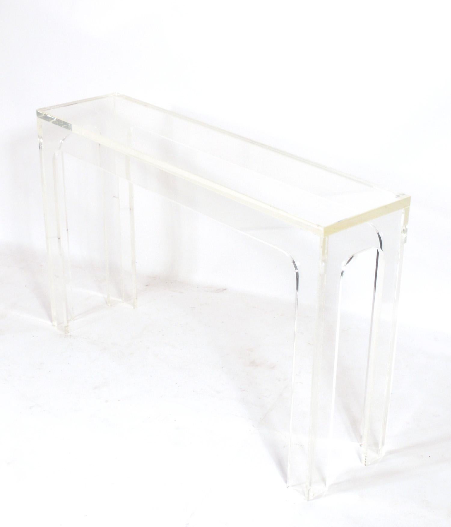 Chunky Lucite or Acrylic Console Table, in the manner of Charles Hollis Jones, American, circa 1960s. This table is a versatile size and can be used as a console, desk, vanity, bar, or entertainment center.
