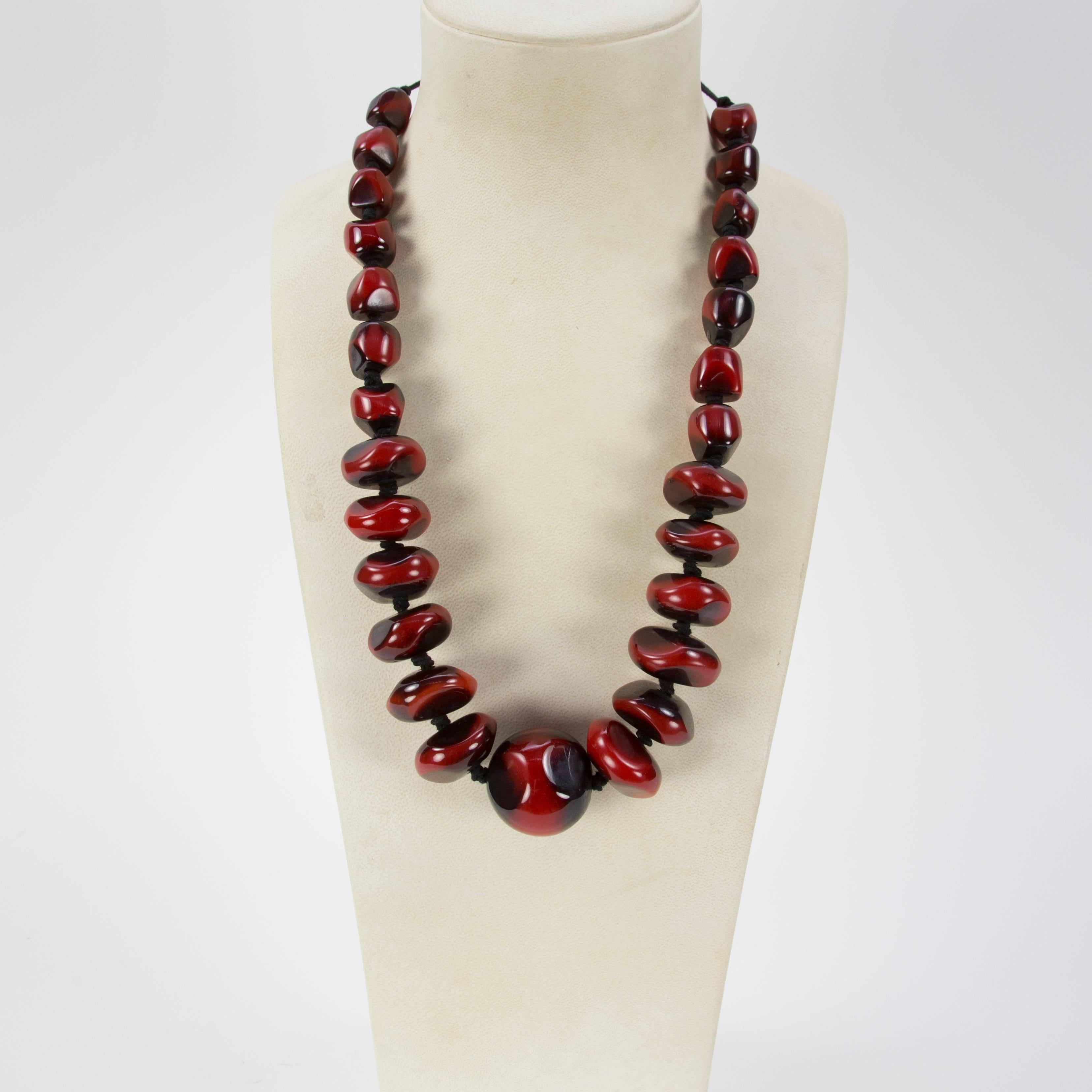 This Impressive necklace features an extraordinary graduated strand of large uniquely shaped Faux Coral resin beads; Beautiful luster! approx.  28” long; Add your own Chic and Dynamic Style to any outfit! 

