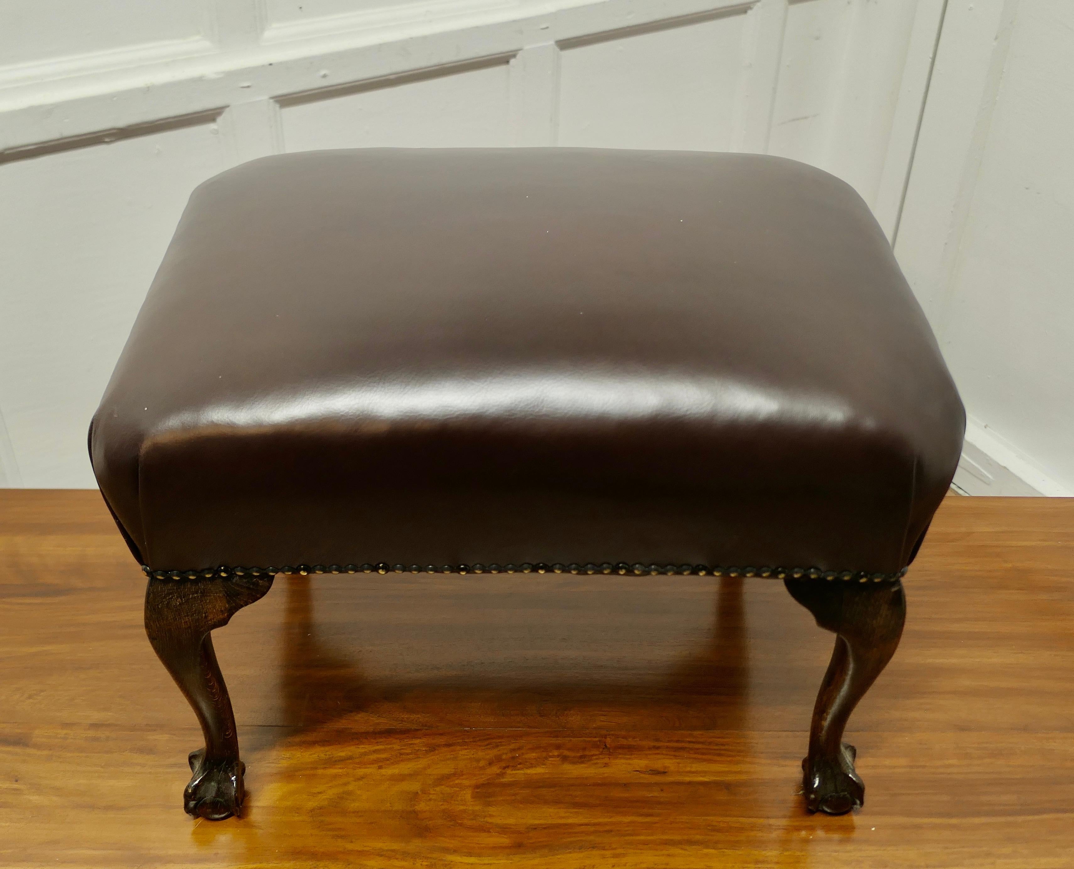 Chunky Oak Cabriole Leg Leather Library Stool  

This is a good Sturdy Stool it has strong cabriole legs 
The stool is upholstered in brown Leather and studded around the edges
This sturdy Stool would work well in almost any room and it is in good