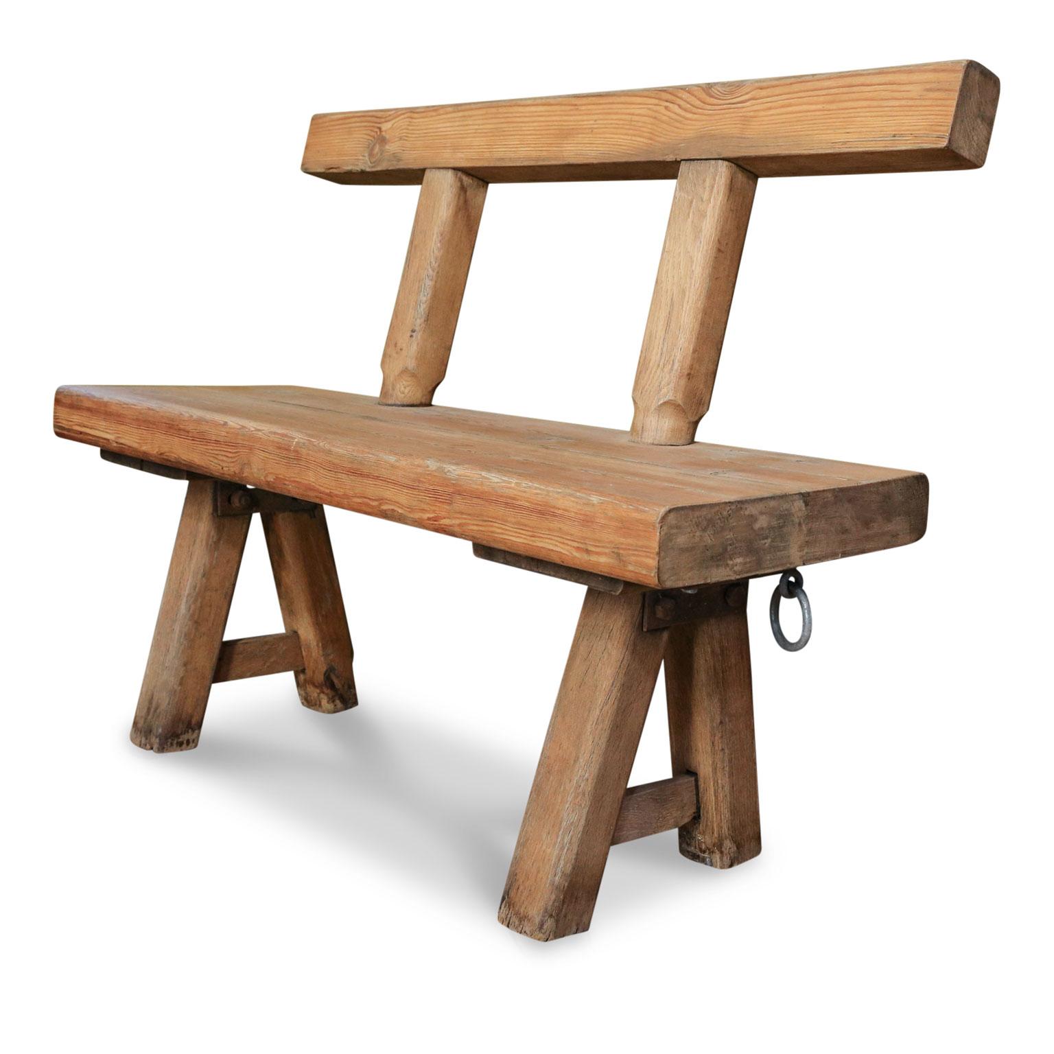 Chunky oak rustic bench (circa 1920-1940), hand-made with massive oak timbers in legged construction and iron brackets. This bench originally comes from a bistro near the Belgian/German border in Alsace-Lorraine.