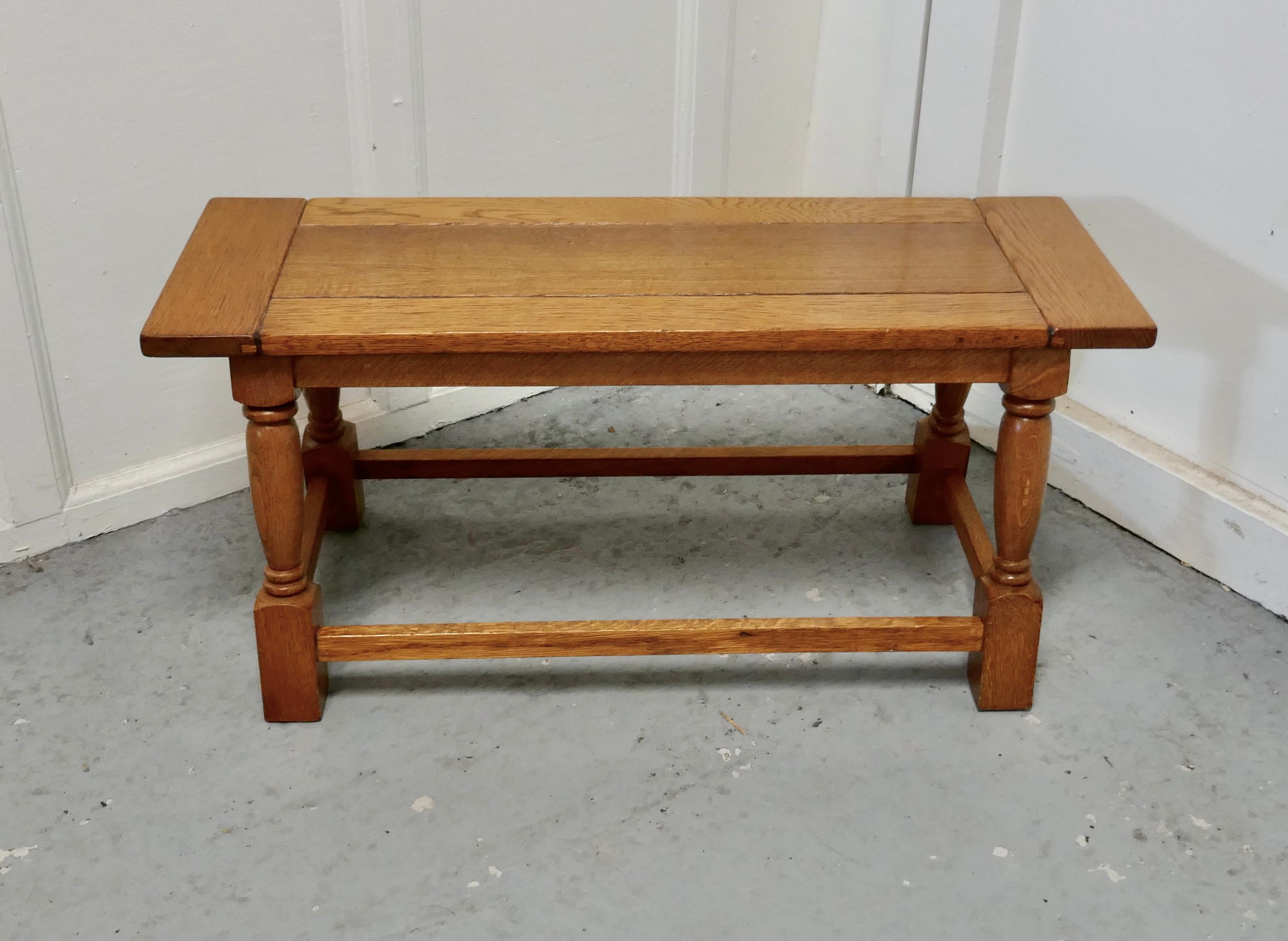 Chunky solid golden oak Arts & Crafts coffee table 

This is a very sturdy table, made in the Arts & Crafts style, it is made in golden oak which has a superb patina and an attractive grain it has a thick cleated top and turned legs 
The table is