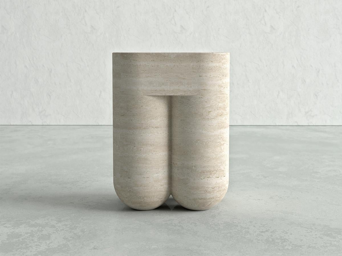Introducing Chunky, a magnificent side table that exudes elegance and sophistication with its curvy design, skillfully carved from a single block of luxurious travertine and finished by hand.

Chunky's form is characterized by graceful curves and