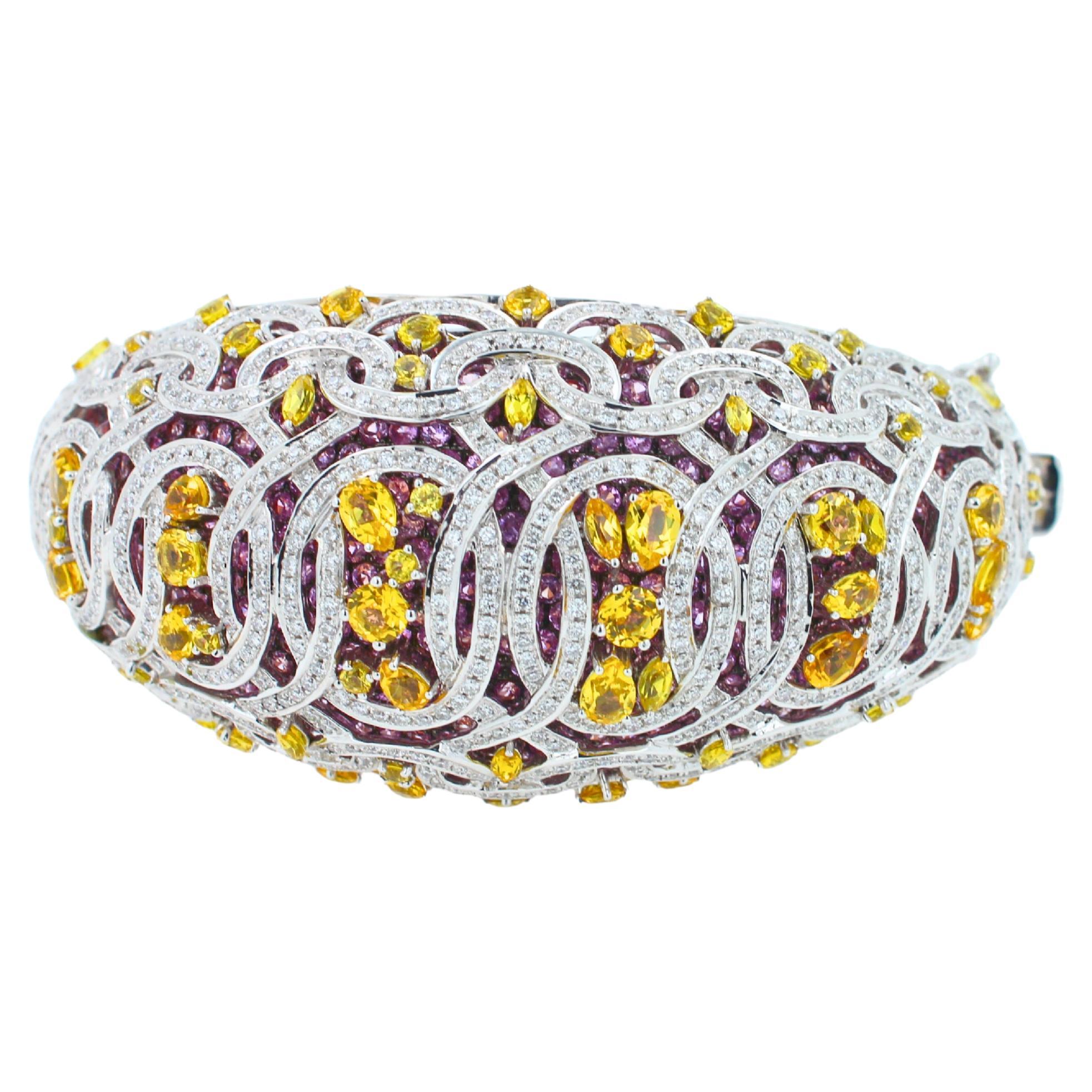 30.00 ctw Rose Pink Sapphires (Pave Set in the Inner Layer of the bracelet creating a one-a-kind pink shimmer & brilliance)
11.00 ctw Yellow Sapphires
8.00 ctw Diamonds 
18K White Gold & Rose Gold
Rain & Curved Nature Motifs in the Metalwork
Very