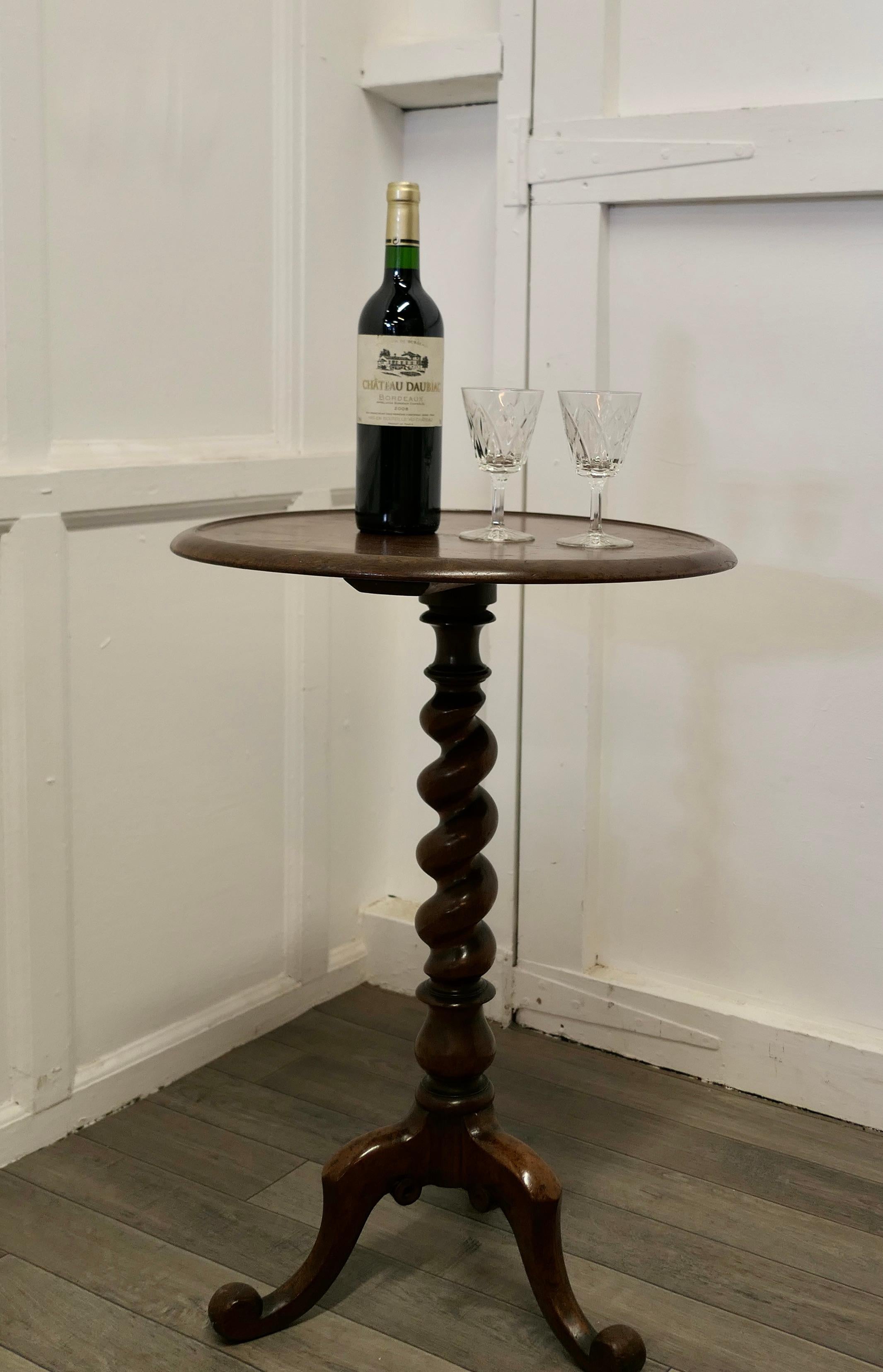 Chunky Victorian Wine Table or Occasional Lamp Table

This lovely table stands on a very attractive Barley Twist three footed leg
It has a solid round top which has a slightly raised edge 
The table is in good attractive condition, if you look