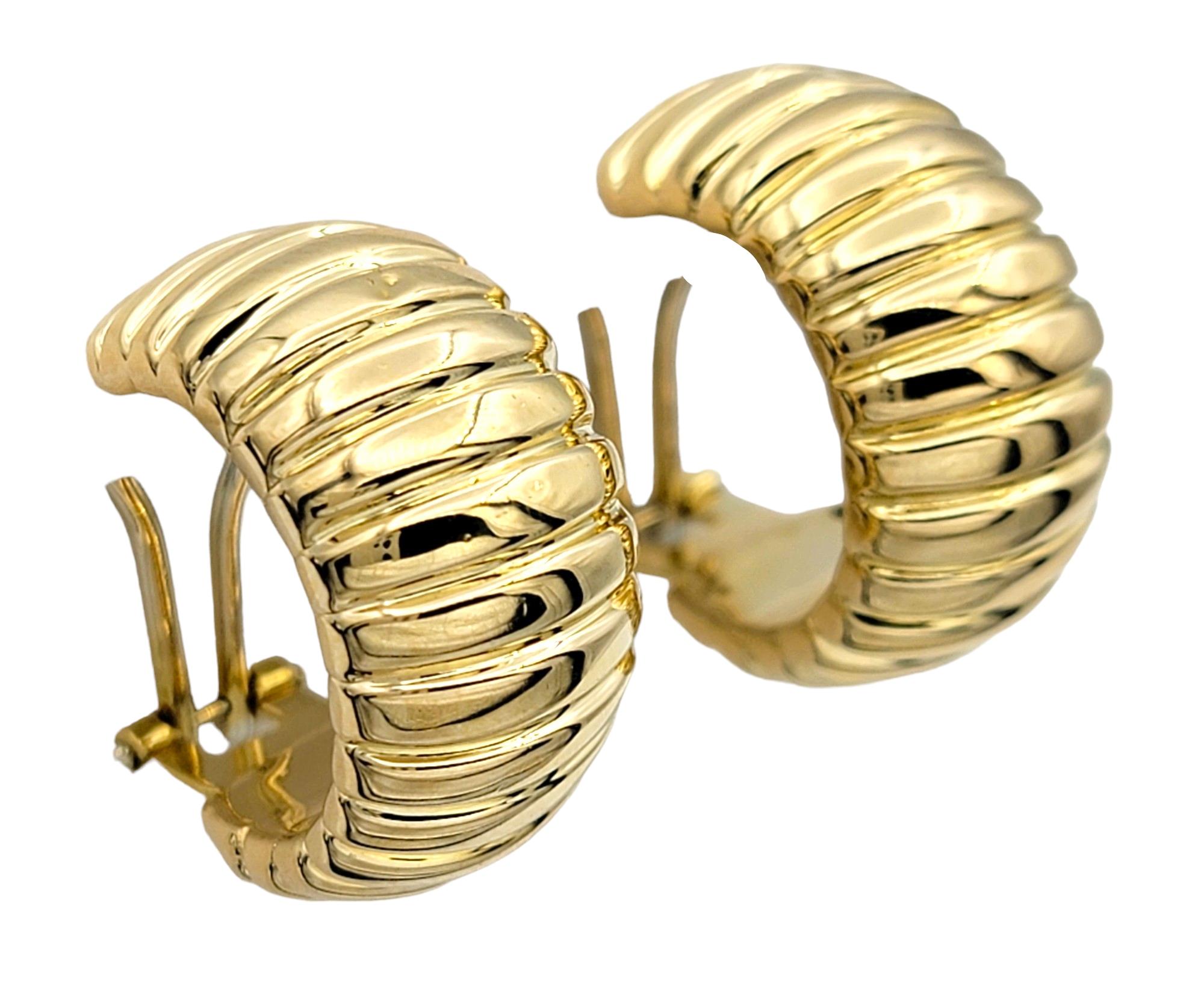 Women's Chunky Wide Ribbed Omega Back Hoop Earrings Set in Polished 18 Karat Yellow Gold For Sale