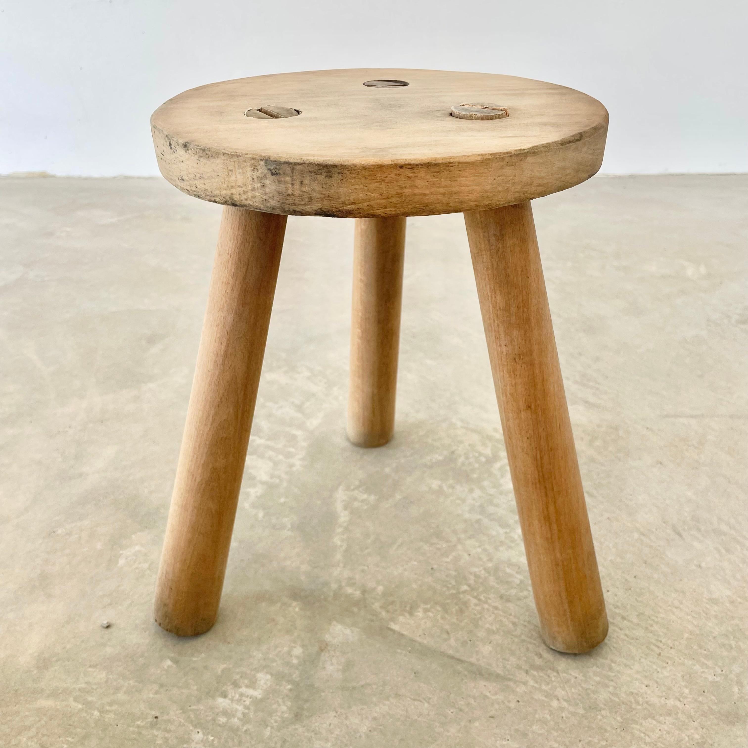 Tripod stool made in France, circa 1970s with a light wood with a raw finish. Great minimalist design. Functional stool. Perfect for books or objects as well. Seat diameter 13