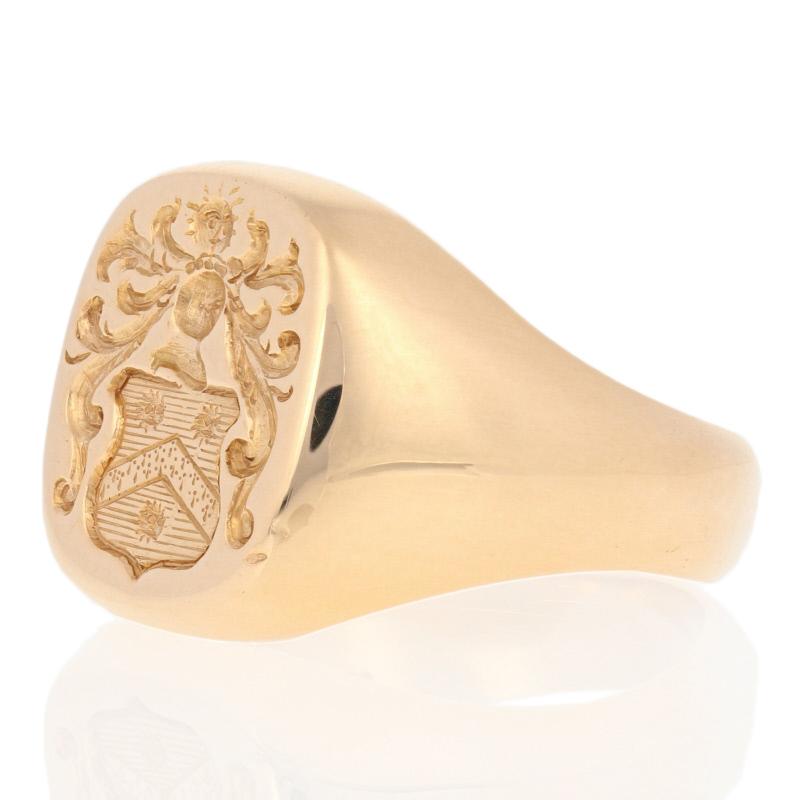 Begin a family tradition with this handsome signet ring! Crafted by Church & Co. in 14k yellow gold, the ring features a heraldic crest with a blazing sun and a knight’s visored helmet positioned above a shield adorned with a chevron and a trio of
