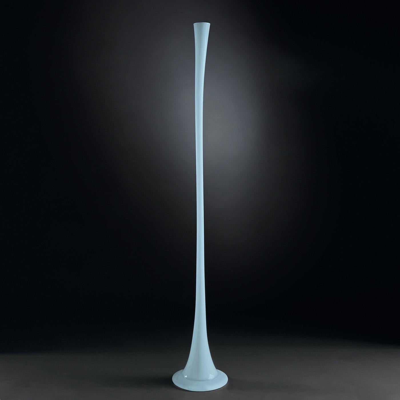 This exquisite glass bud vase is distinguished by a stylish purist blue hue that lends its two-meter tall silhouette a contemporary quality. Masterfully crafted by expert hands, it is a refined objet d'art that will make a statement of its own or