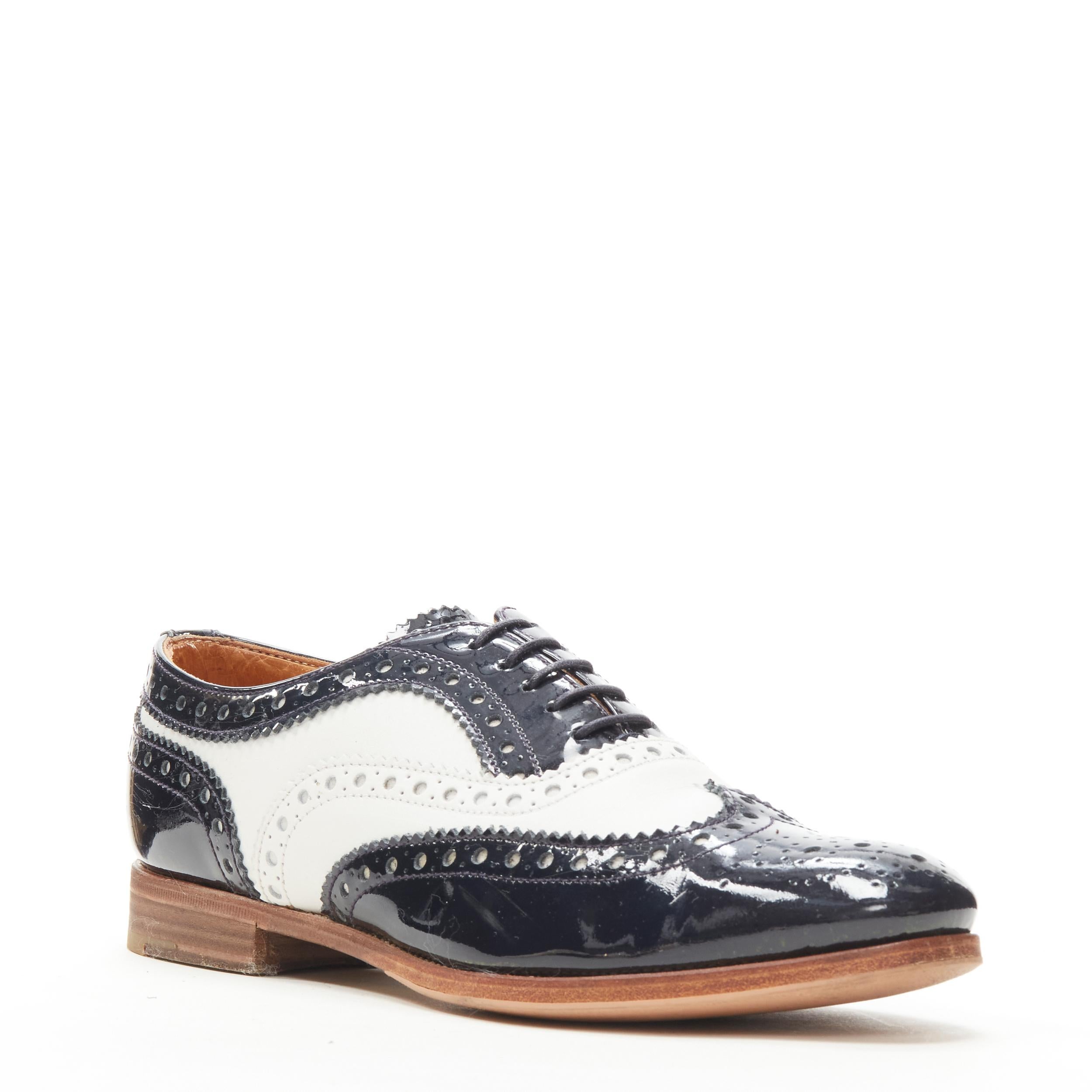 CHURCH'S Burwood black patent white perforated leather brogue EU36 
Reference: ANWU/A00381 
Brand: Church's 
Model: Burwood 
Material: Leather 
Color: Black 
Pattern: Solid 
Closure: Lace 
Extra Detail: Stacked wooden sole. 
Made in: Italy