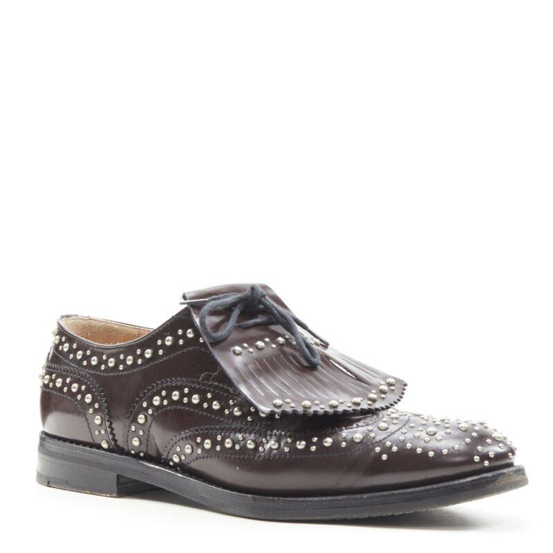 CHURCH'S Burwood Met Cordovan dark brown silver studded fringe brogue EU36
Reference: ANWU/A00383
Brand: Church's
Model: Burwood
Material: Leather, Metal
Color: Brown, Silver
Pattern: Solid
Closure: Lace Up
Lining:  Leather
Extra Details: Detachable