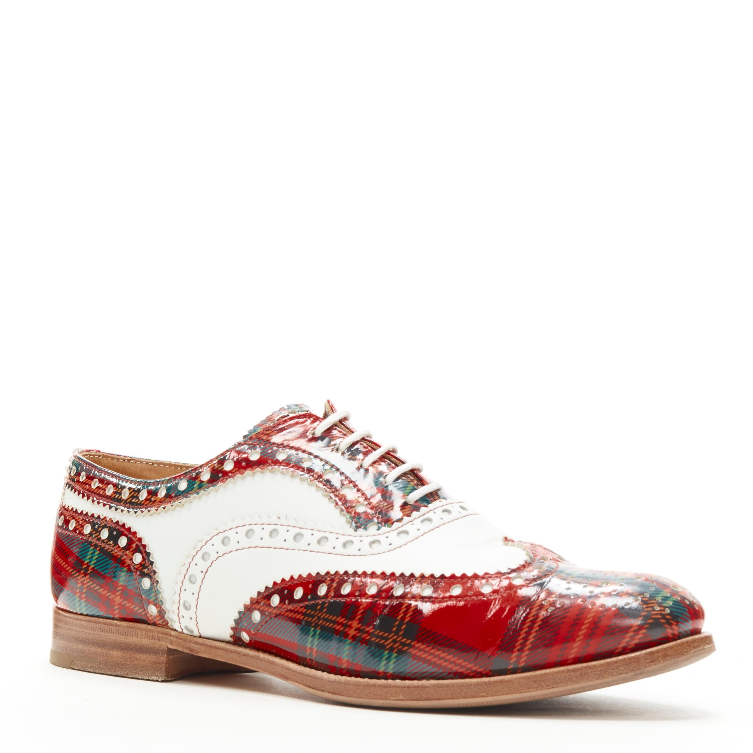 CHURCH'S Burwood red tartan patent white perforated leather brogue EU36.5 
Reference: ANWU/A00384 
Brand: Church's 
Model: Burwood 
Material: Leather 
Color: Red 
Pattern: Plaid 
Closure: Lace 
Extra Detail: Stacked wooden sole. 
Made in: Italy