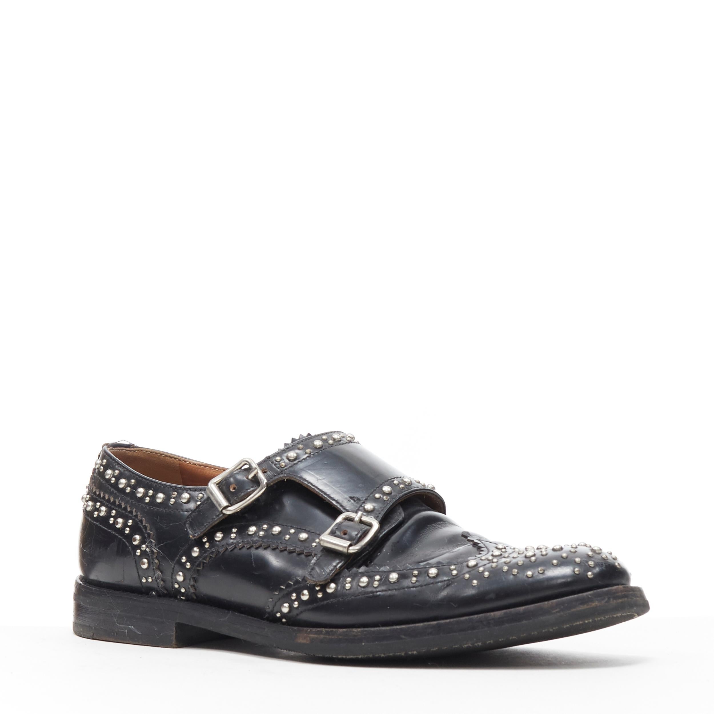 CHURCHS Lana Met black silver stud dual buckle monk brogue loafer shoe EU36 
Reference: EACN/A00107 
Brand: Churchs 
Material: Leather 
Color: Black 
Pattern: Solid 
Closure: Buckle 
Extra Detail: Lana met. Black leather with silver tone stud.