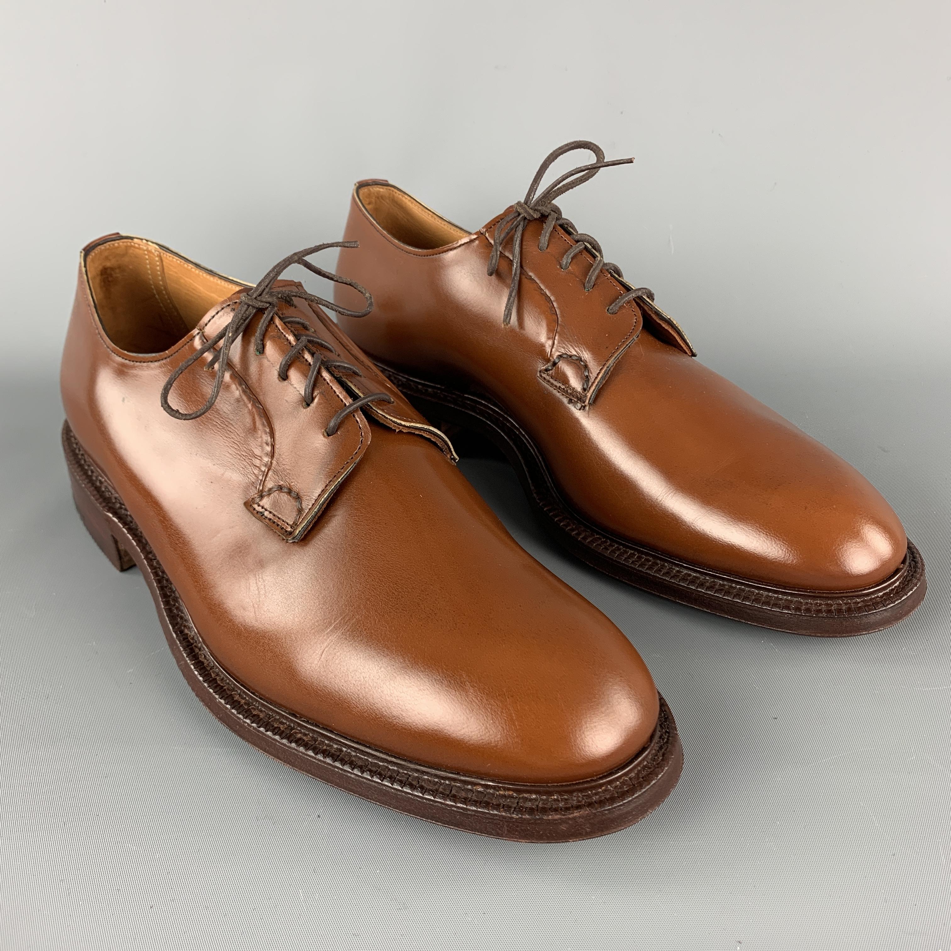 CHURCH'S Lace Up Shoes comes in a solid tan leather material, featuring a contrast stitch and a leather sole. Made in England.

New with Box.
Marked: UK 9D

Outsole: 11 3/4 x 4 1/4 in. 