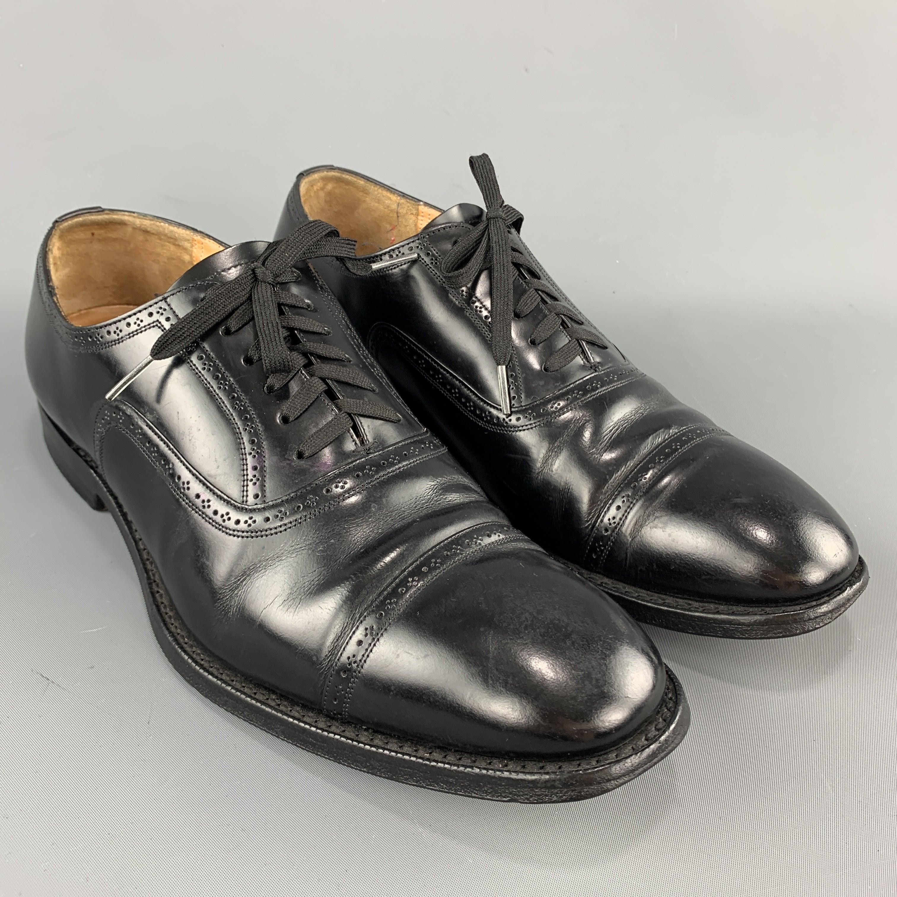 CHURCH'S dress shoes come in smooth black leather brogue trim and a cap toe. Wear throughout. As-is. Made in England.Good
Pre-Owned Condition. 

Marked:   75Outsole: 11.75 x 4.25 inches 
  
  
 
Reference: 99105
Category: Lace Up Shoes
More Details
