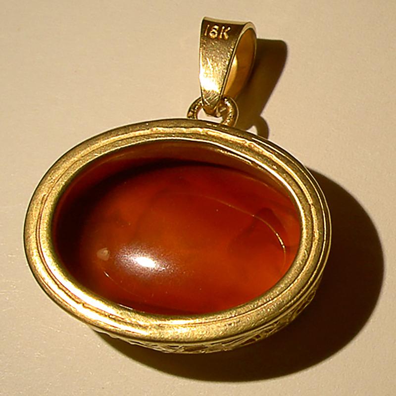 This exquisite intaglio is masterfully engraved onto carnelian gemstone and features a depiction of a bull. The stone is set in a 18K karat gold pendant. 

Production time for this piece is up to 10 weeks.

Price does not include chain.

Chavdar