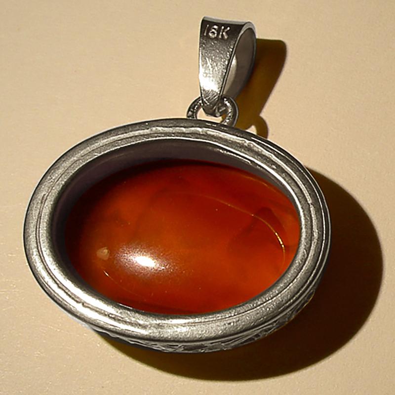 This exquisite intaglio is masterfully engraved onto carnelian gemstone and features a depiction of a bull. The stone is set in a 925 sterling silver pendant. 

Production time for this piece is 4-6 weeks.

Price includes 16