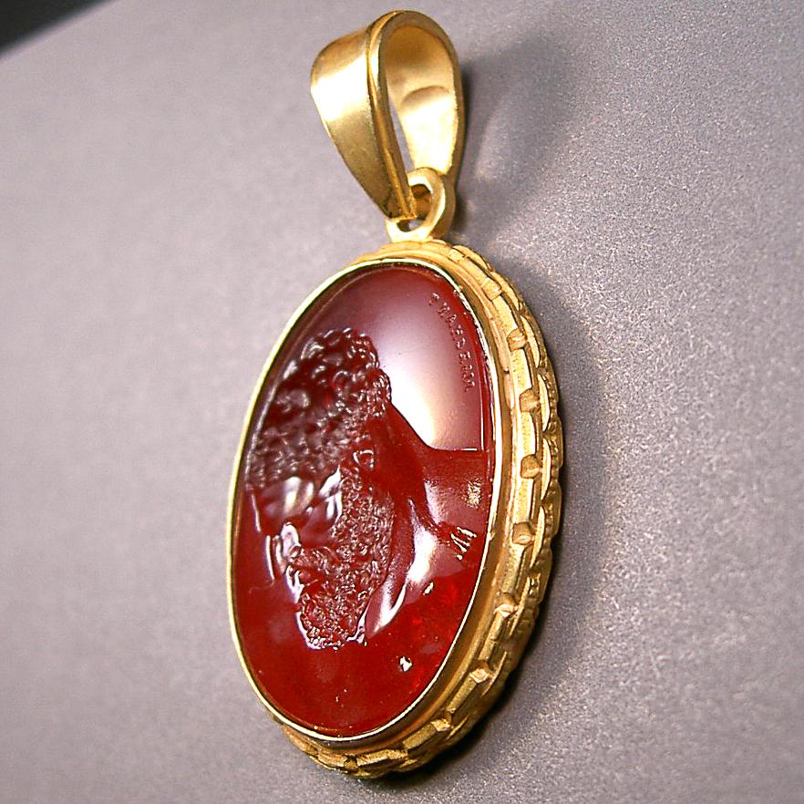 Crafted in Los Angeles with vibrant amber colored glass following an ancient Roman recipe, masterfully hand finished, and set in a 18K gold pendant.

Production time for this piece is 4-6 weeks.

Price does not include chain.

Chavdar Chushev is an