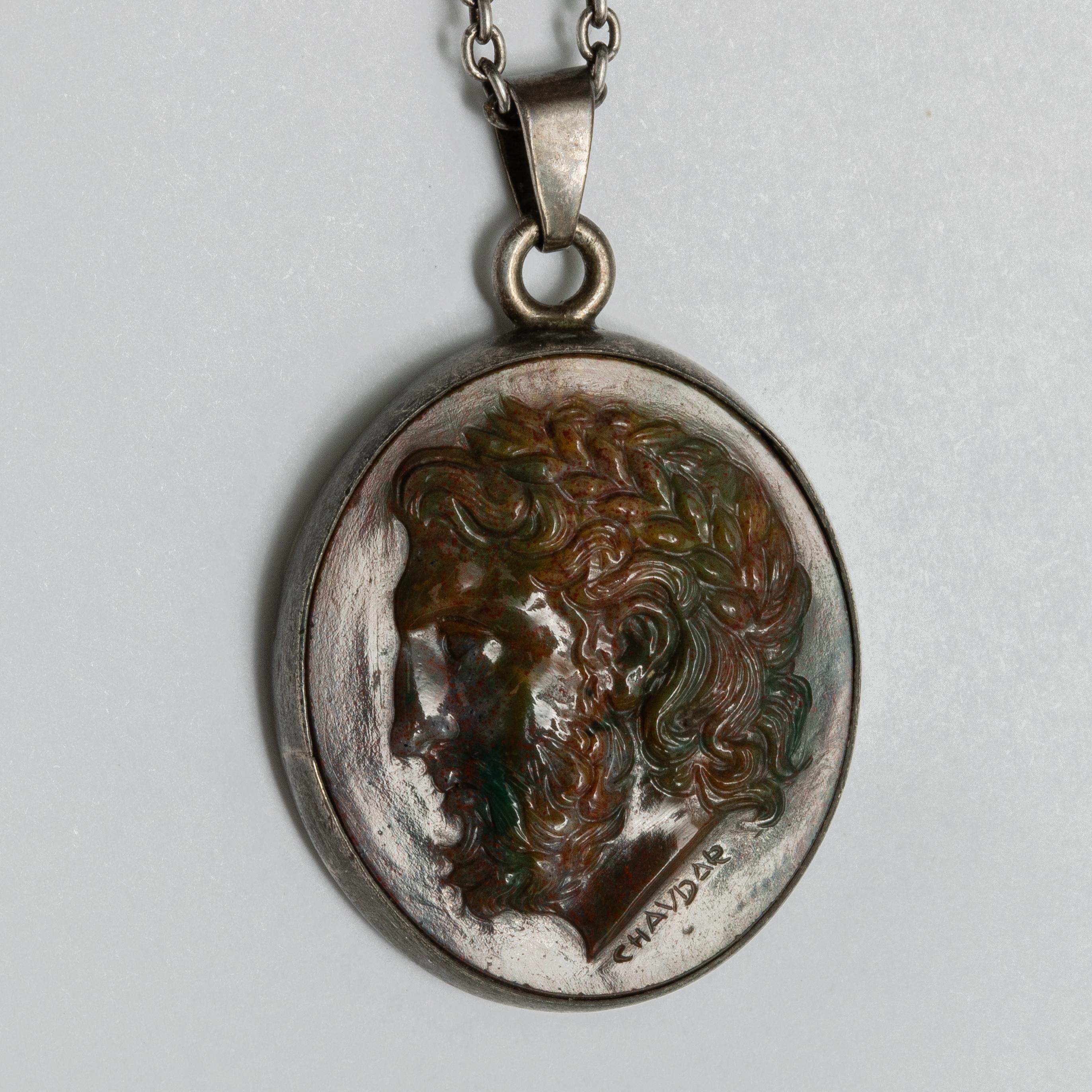 This exquisite intaglio is masterfully engraved onto bloodstone and features a depiction Zeus. The stone is set in a 925 sterling silver pendant.

Production time for this piece is 4-6 weeks.

A 16