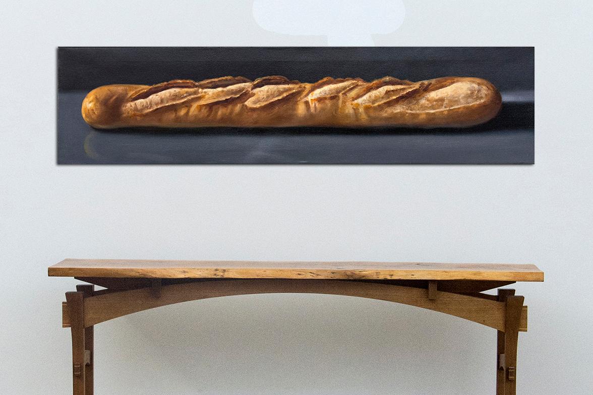 A French baguette is set against a charcoal ground in this realistically rendered, classic still life painting by Ciba Karisik. In addition to the skillful use of trompe l'oeil, the artist has heightened the importance of the subject through