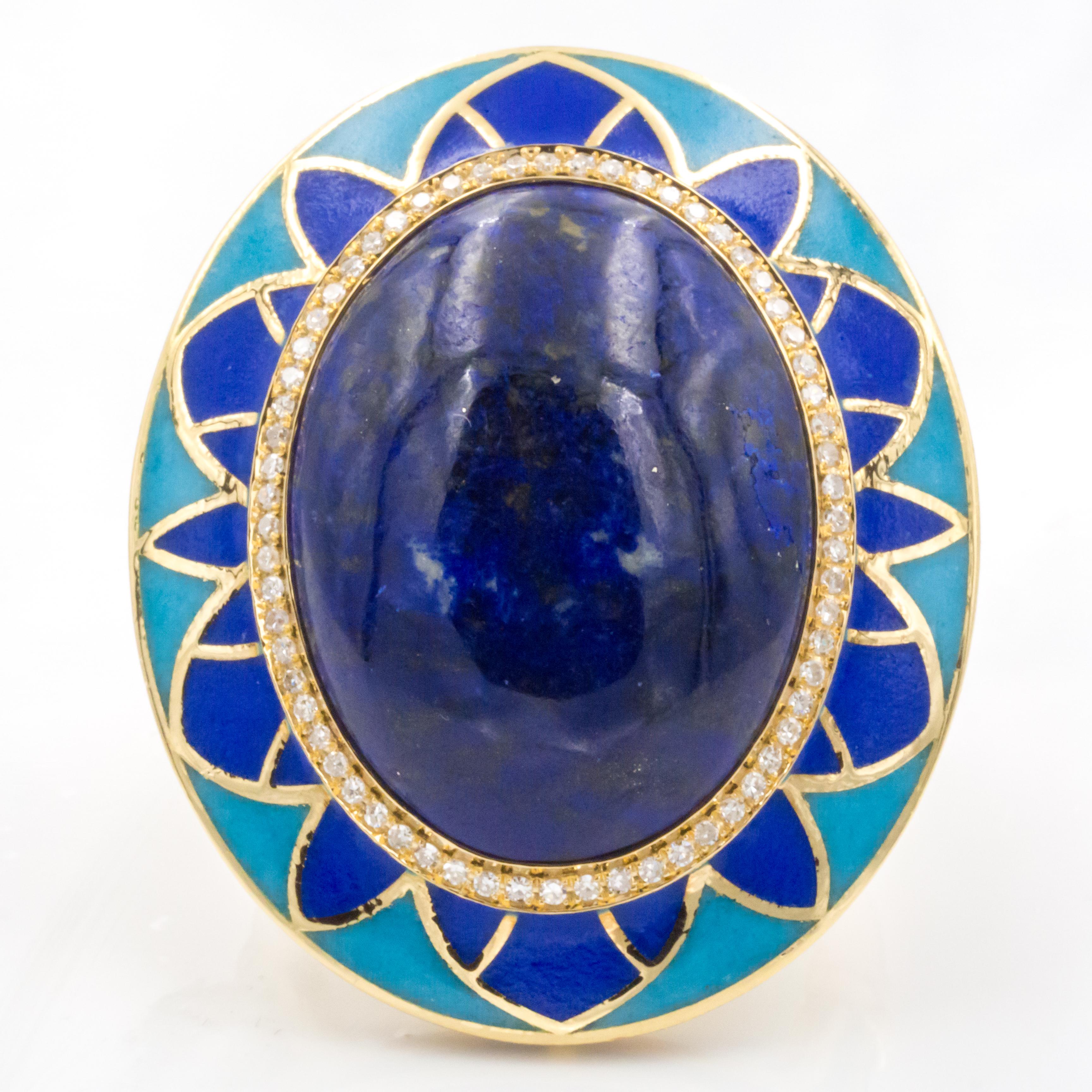 This Egyptian-Revival 18k gold cocktail ring features a cabochon lapis lazuli center, with a melee diamond halo. Beautiful enamel work compliment the colors of the center stone.

Lapis Lazuli: 18.21 ct
Diamonds: 0.65 ct
Metal: 18k Yellow Gold
Ring