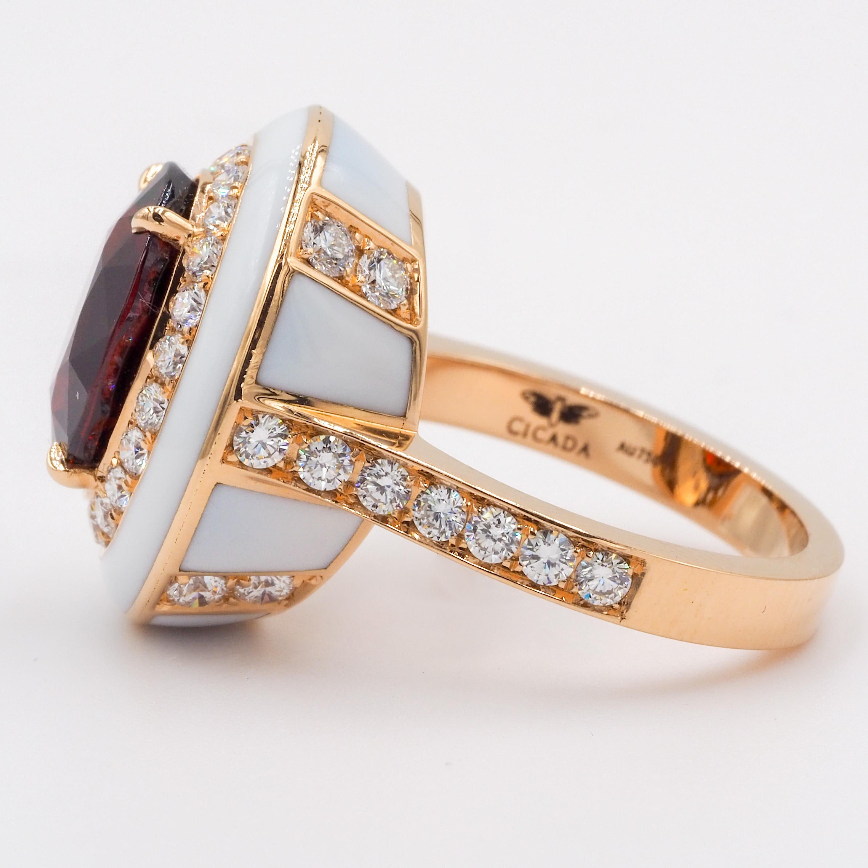 This 18k rose gold cocktail ring features an oval red garnet center, surrounded by diamonds. The off-white enamel ceramic enhances the color of the beautiful center stone.

Red Garnet Center: 6.76ct
Diamonds: 1.12ct
Ring Size: 6 (can be