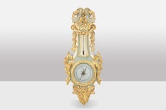 Cicery. Barometer in carved and gilded wood. 18th century period.