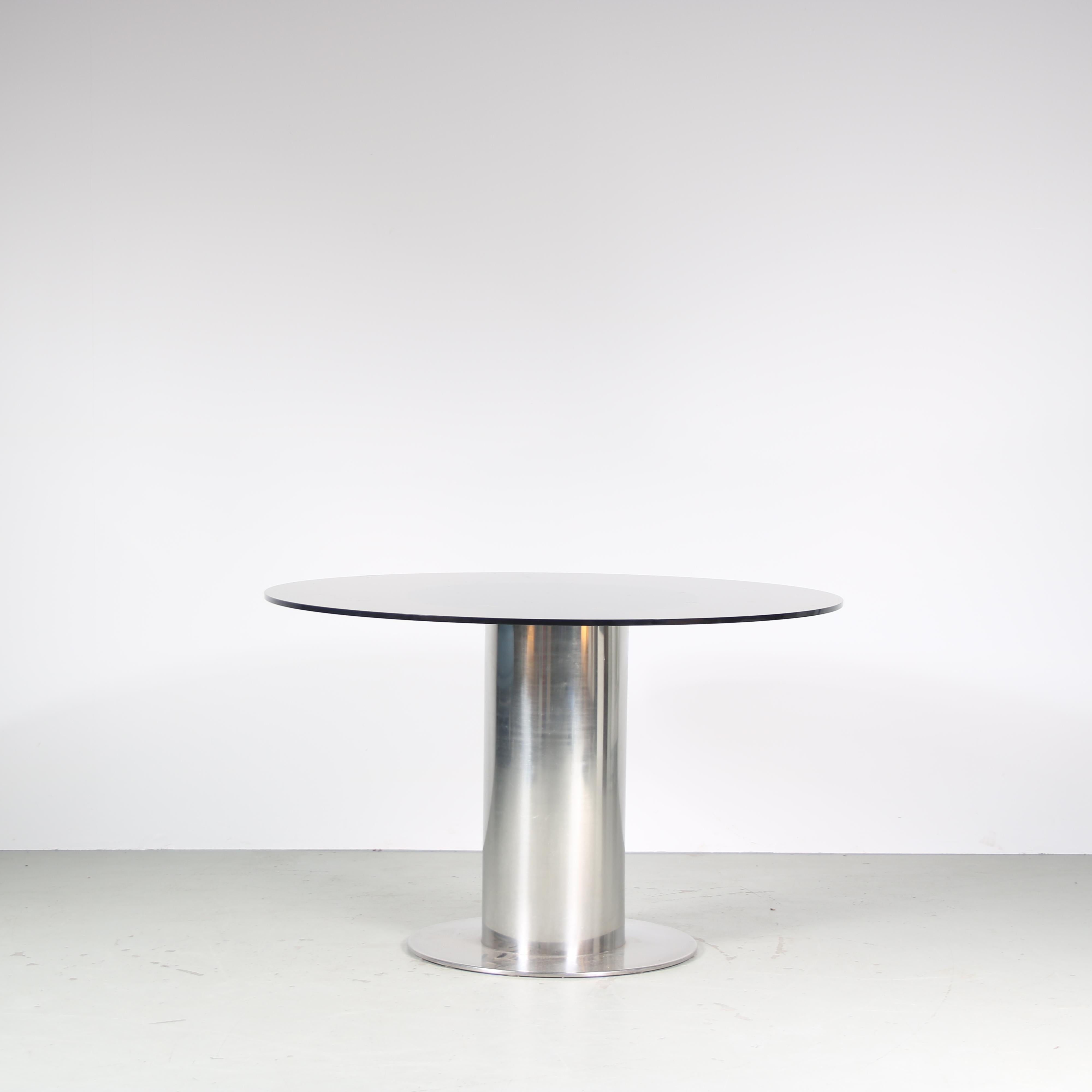 An eye-catching dining table, model “Cidonio”, designed by Antonia Astori, manufactured by Cidue in Italy around 1960.

This modern table is a true statement piece in the decor! It has a thick cylinder shaped, chrome plated metal base on a flat