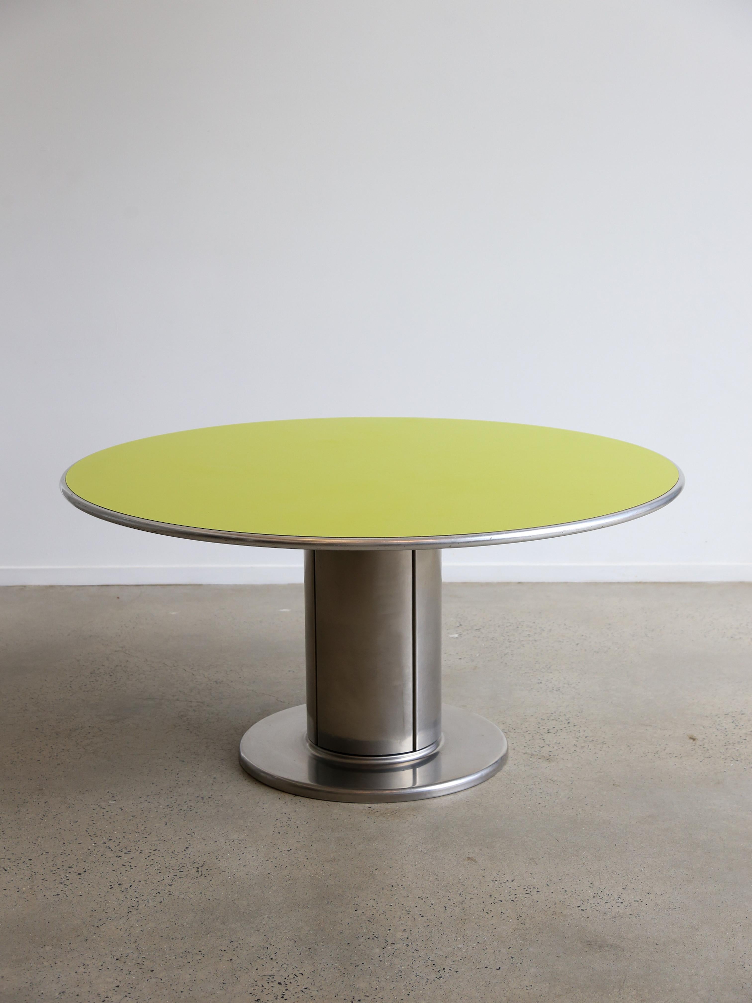 An eye-catching dining table, model “Cidonio”, designed by Antonia Astori, manufactured by Cidue in Italy around 1960.

This modern table is a true statement piece in the decor! It has a thick cylinder shaped, chrome plated metal base on a flat
