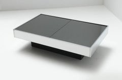 Tavolino da caffè Cidue con bar a secco nascosto in acciaio inossidabile e vetro , anni '70